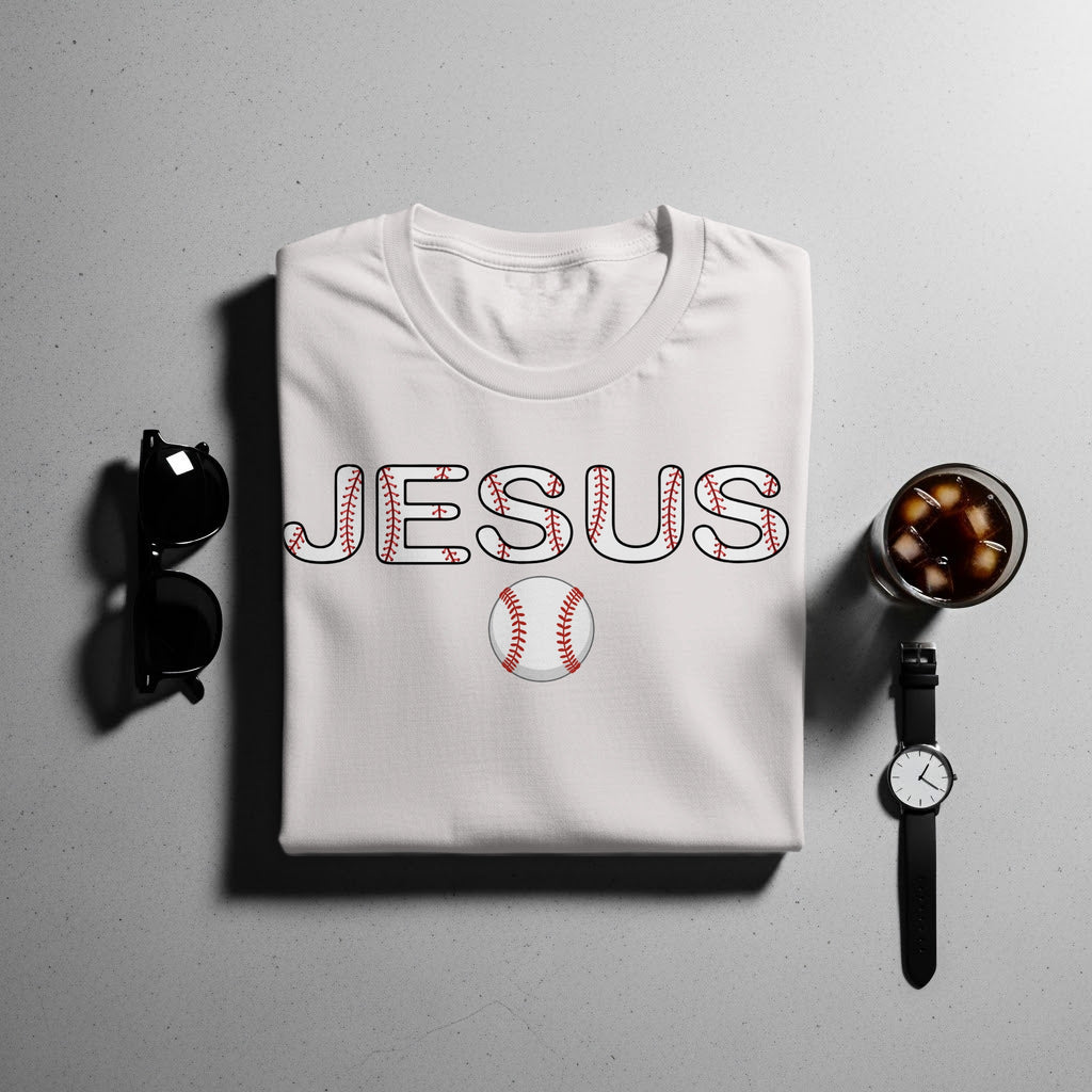 White t-shirt with "JESUS" in baseball stitching and a baseball graphic.