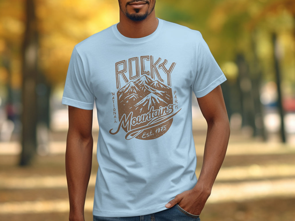 Light blue t-shirt with brown Rocky Mountains graphic and "Est. 1975" text.