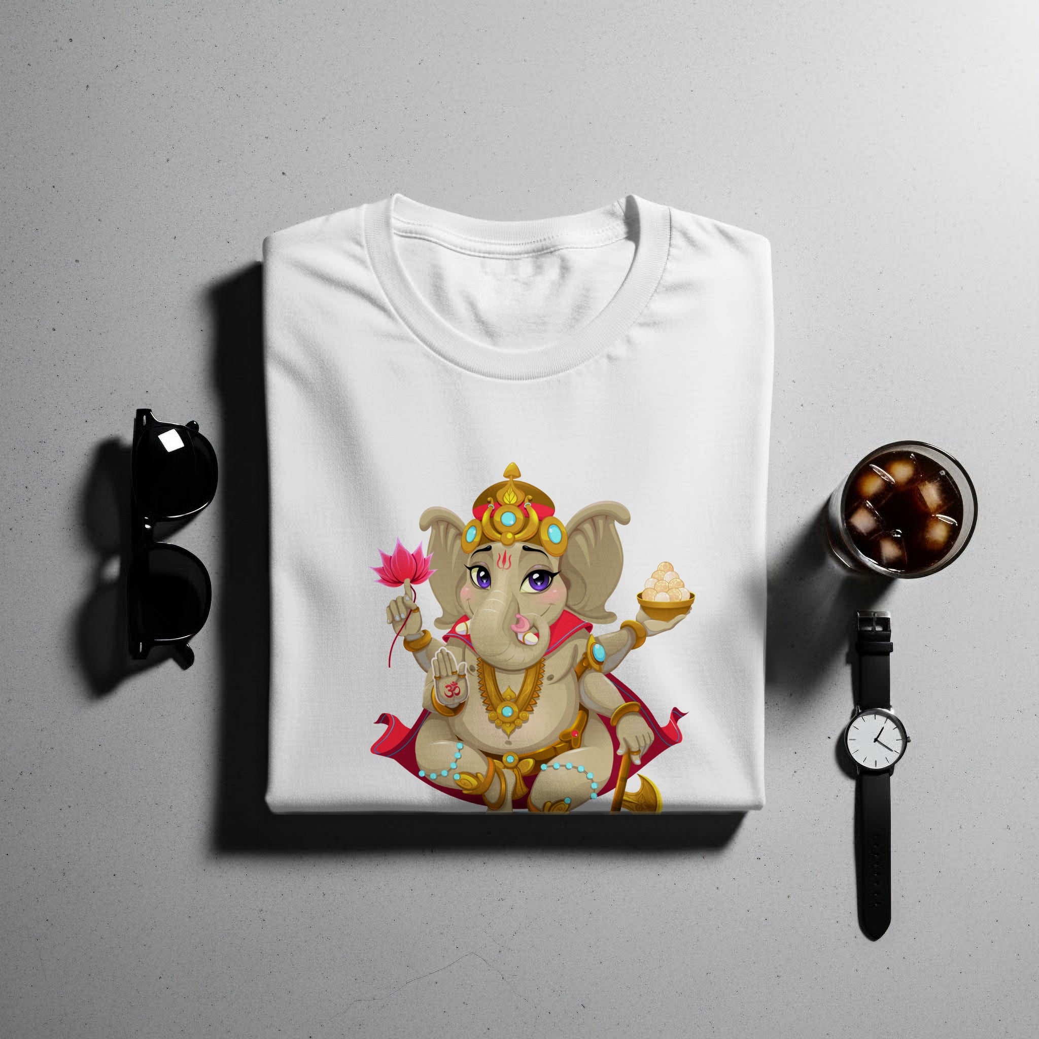 White t-shirt with a colorful Ganesha graphic, sunglasses, and a drink.