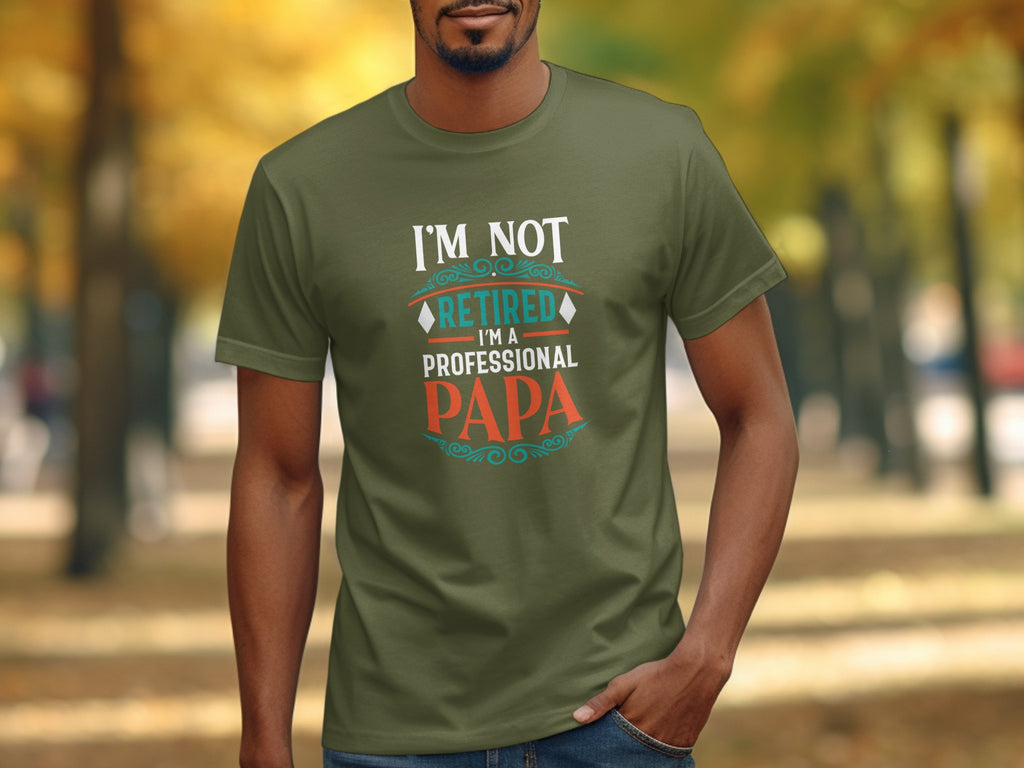 Green t-shirt with text "I'M NOT RETIRED I'M A PROFESSIONAL PAPA".