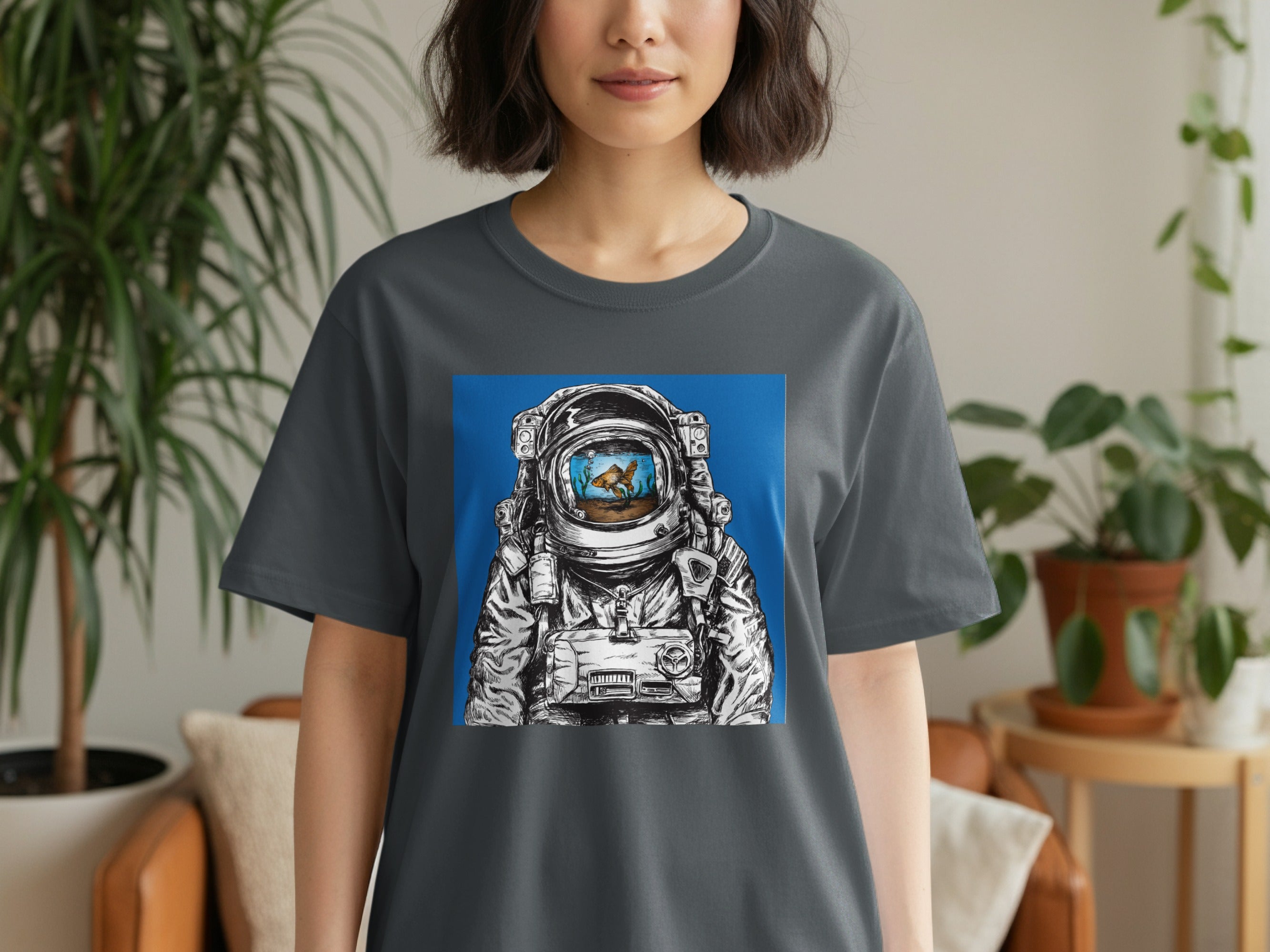 Astronaut helmet with goldfish in a tank reflecting in the visor.