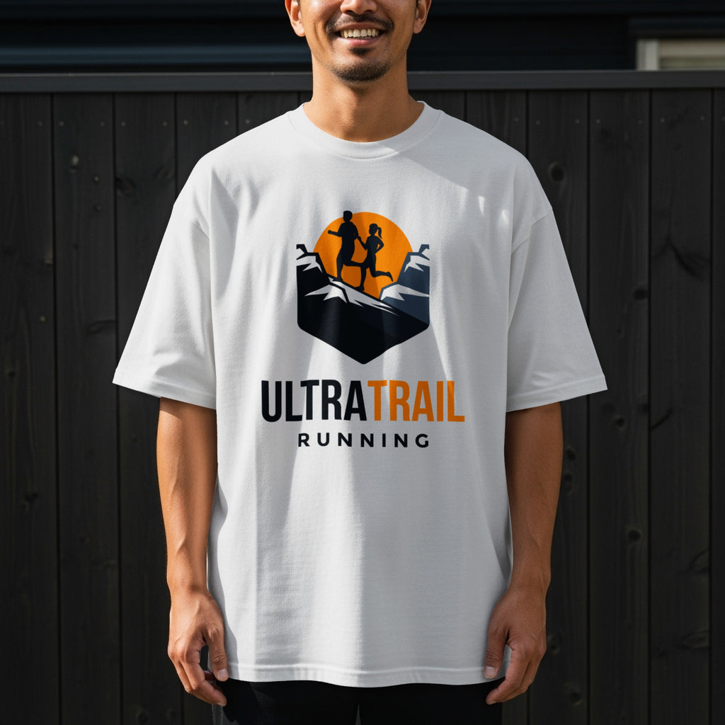 White t-shirt with "ULTRA TRAIL RUNNING" logo featuring silhouettes of runners on mountains.