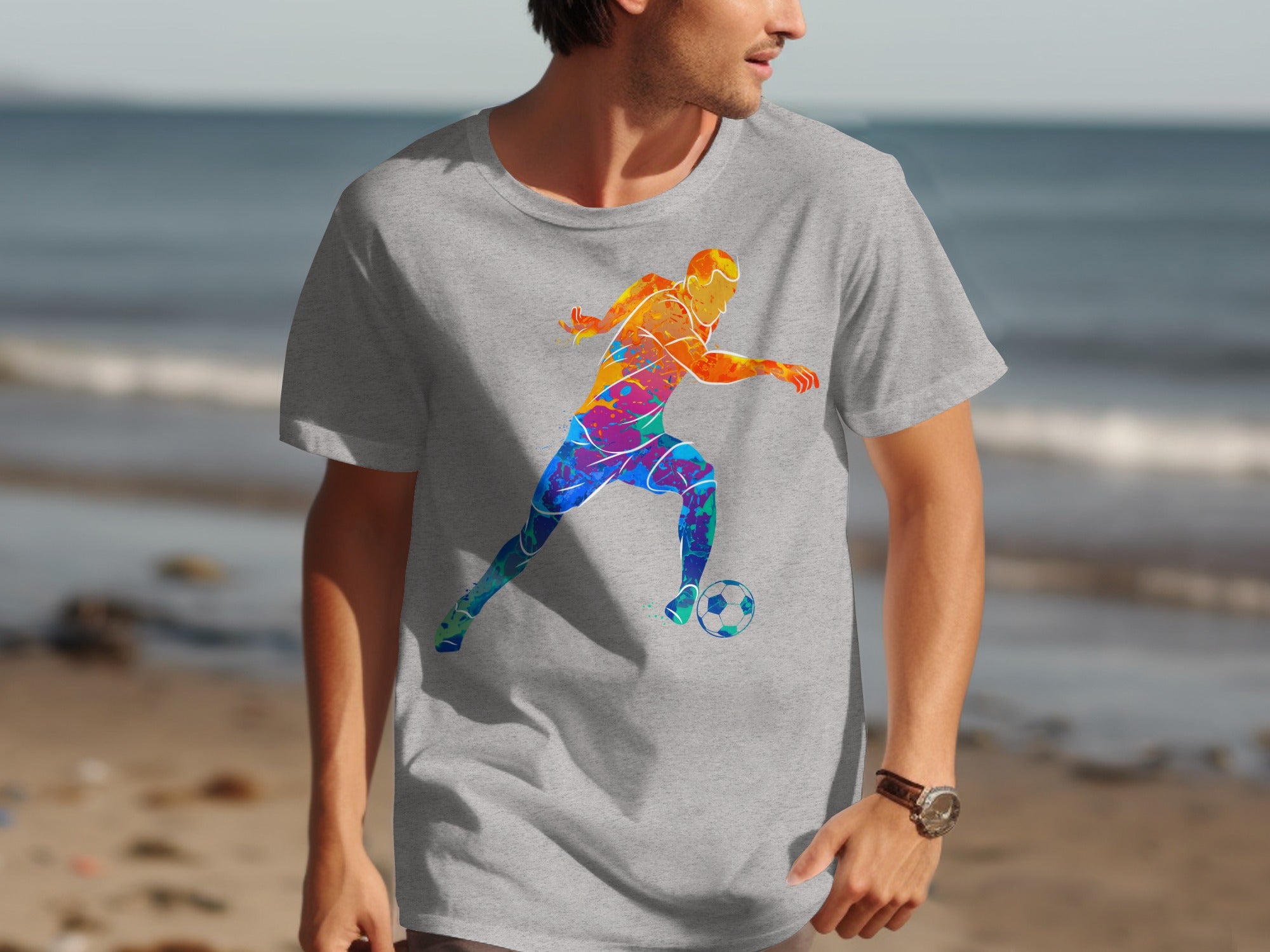 Grey t-shirt with colorful abstract soccer player graphic on front.