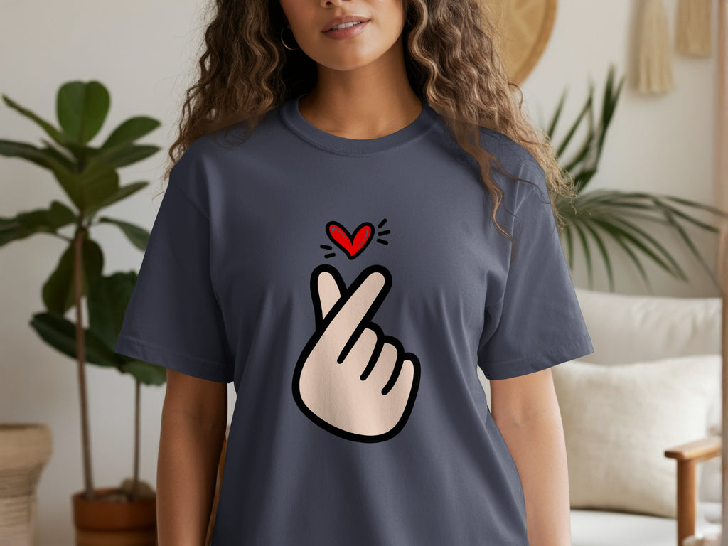 Dark blue t-shirt displaying a cartoon hand making a finger heart gesture above a red heart.