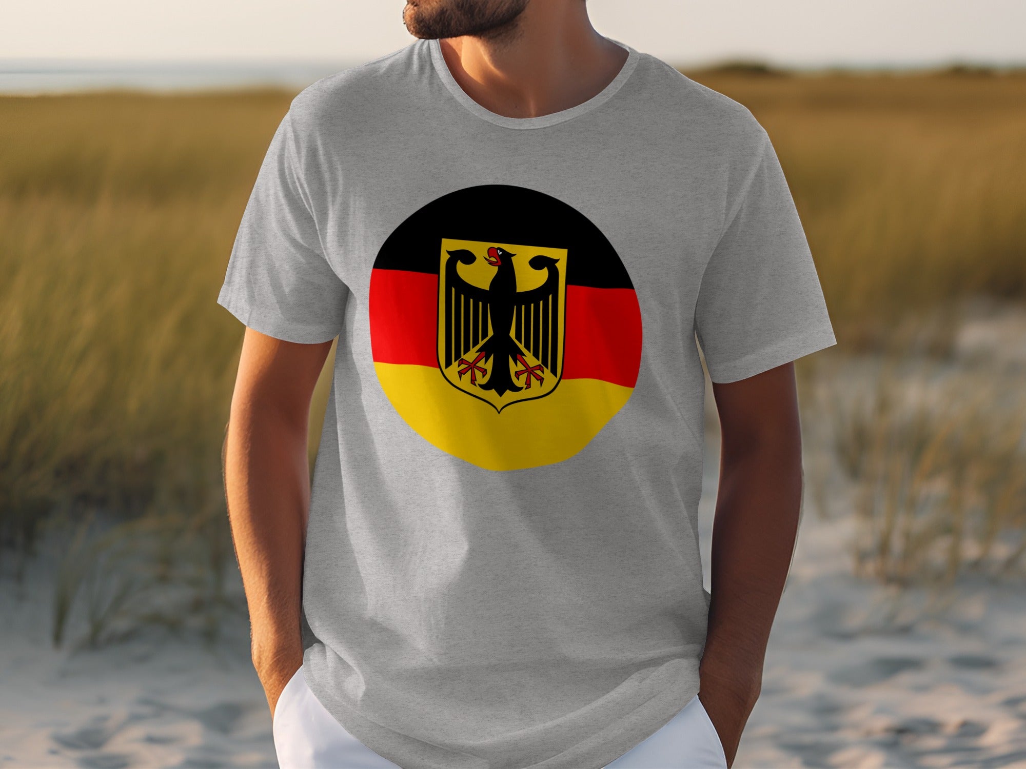 Grey t-shirt with German flag emblem featuring a black eagle on a circular background.
