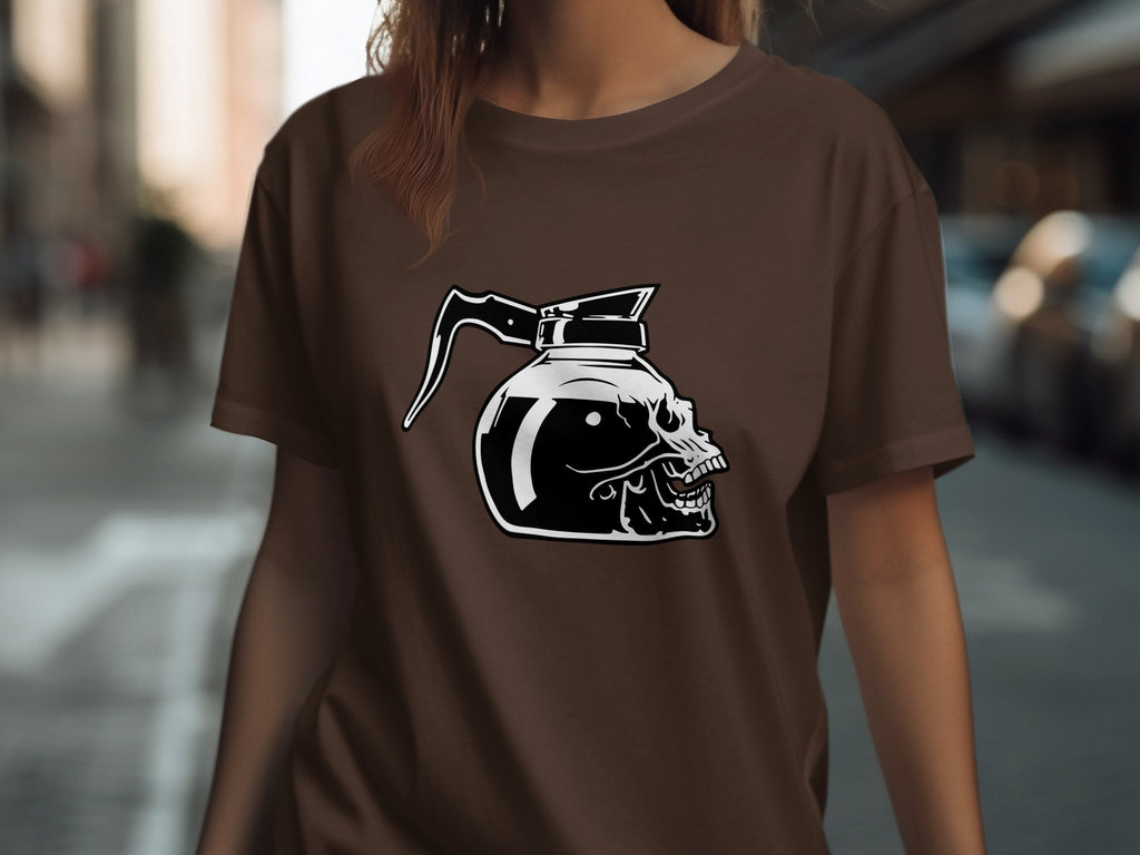 Black and white graphic of a skull-shaped coffee pot on a brown t-shirt.