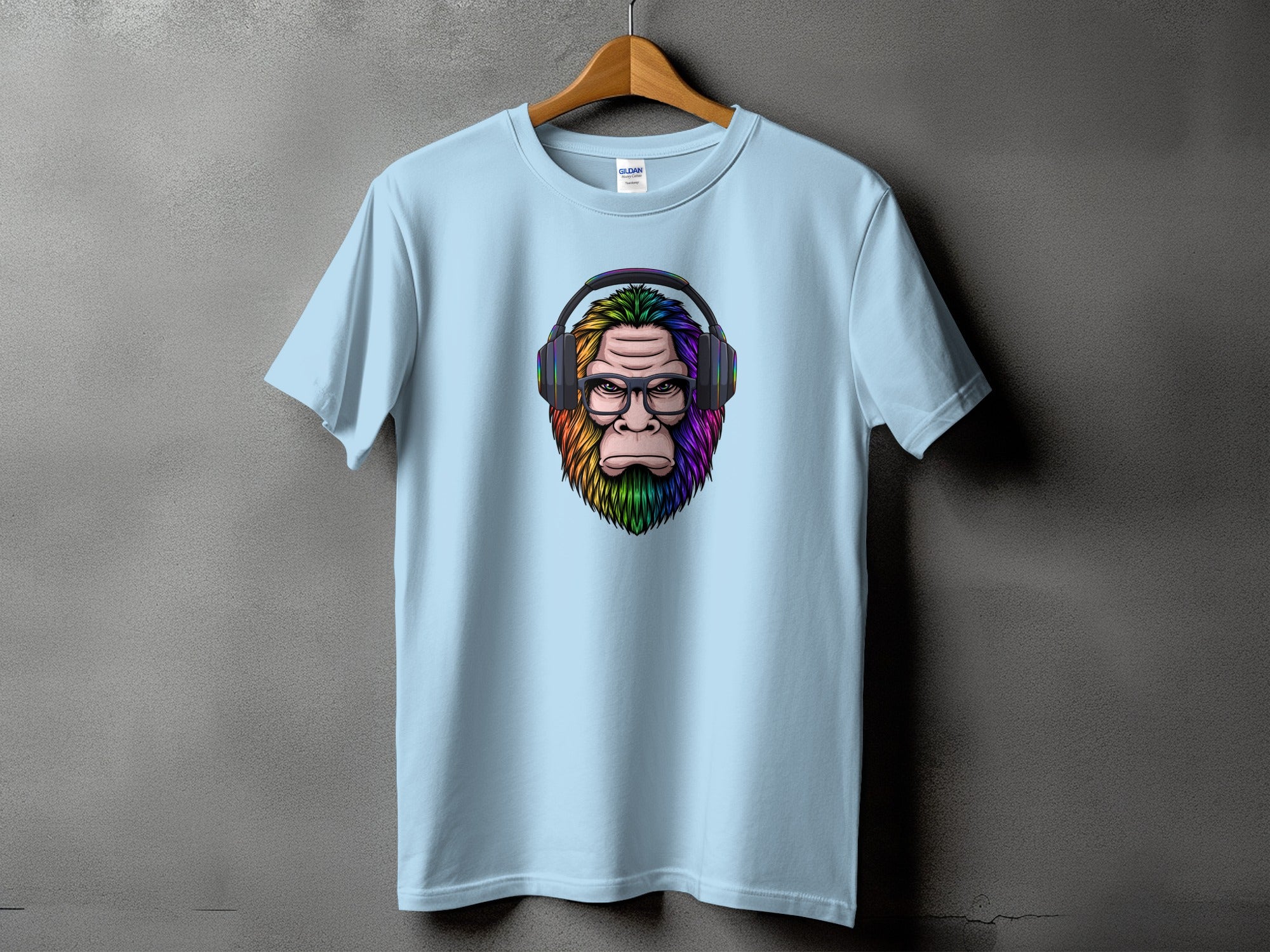 Light blue t-shirt with a colorful ape illustration wearing headphones and glasses.