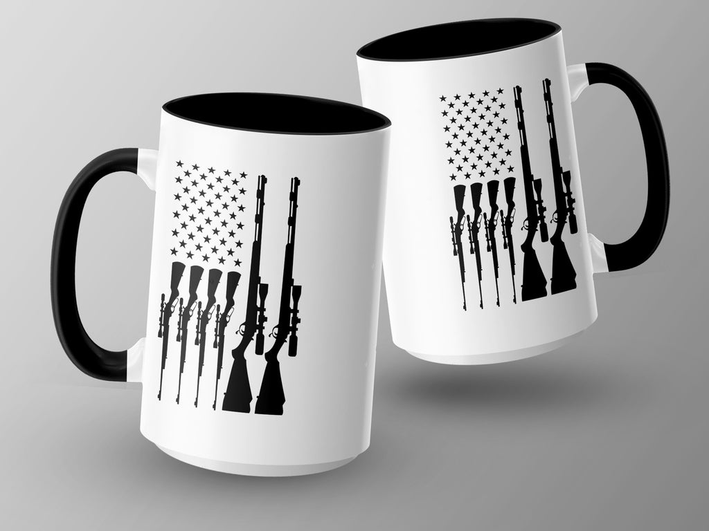 Two white mugs with black handles and rims, featuring American flag design with rifle silhouettes.