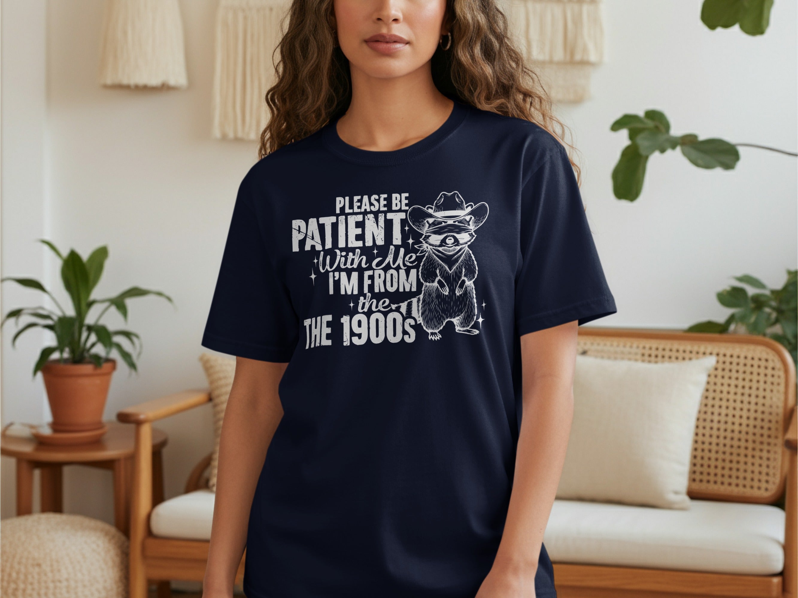 Dark blue t-shirt with raccoon wearing cowboy hat and text "Please Be Patient With Me, I'm From The 1900s".