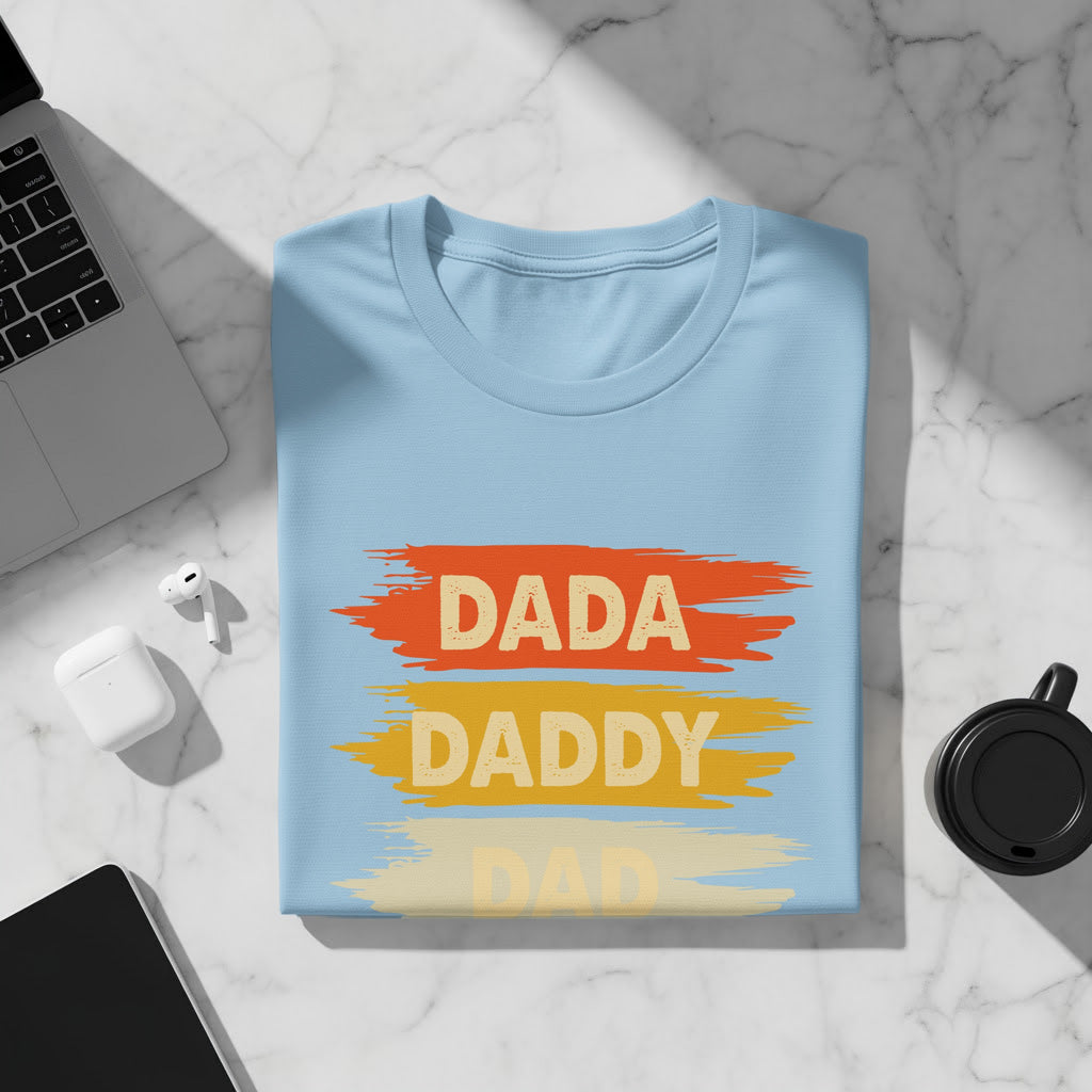 Light blue t-shirt with "DADA" and "DADDY" written in distressed style.