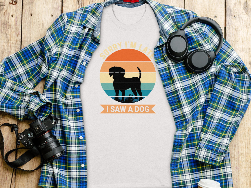 White t-shirt with dog graphic: "SORRY I'M LATE I SAW A DOG".