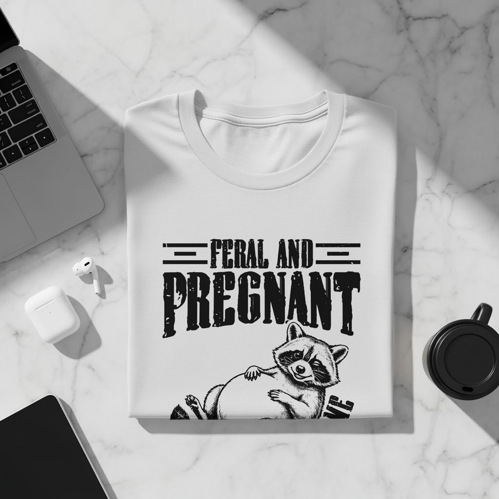 White t-shirt with "Feral and Pregnant" text and a raccoon illustration.