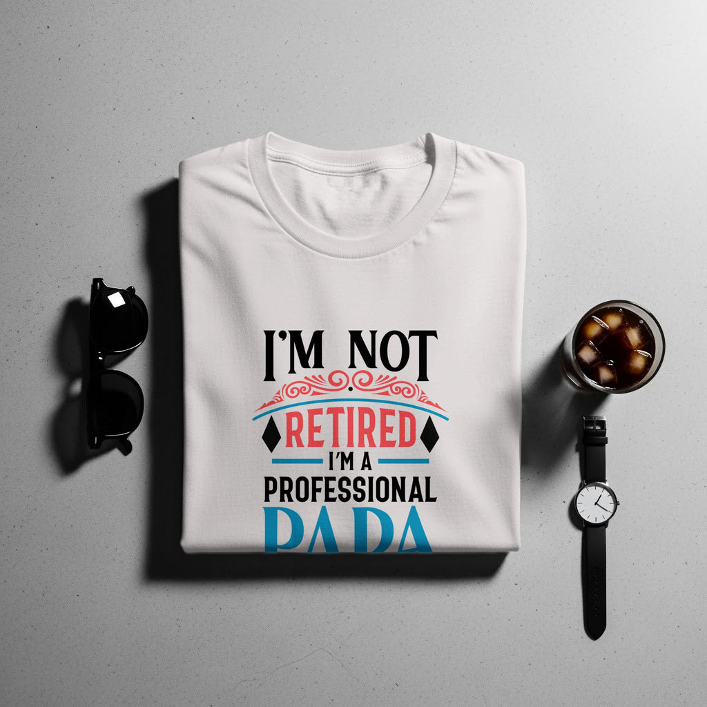 White t-shirt with "I'm not retired, I'm a professional DADA" text.
