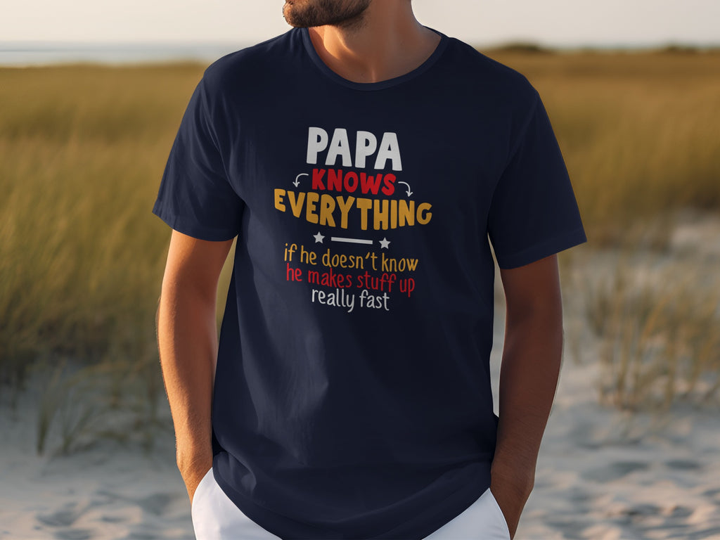 Dark navy t-shirt with "PAPA KNOWS EVERYTHING" and humorous text about papas.