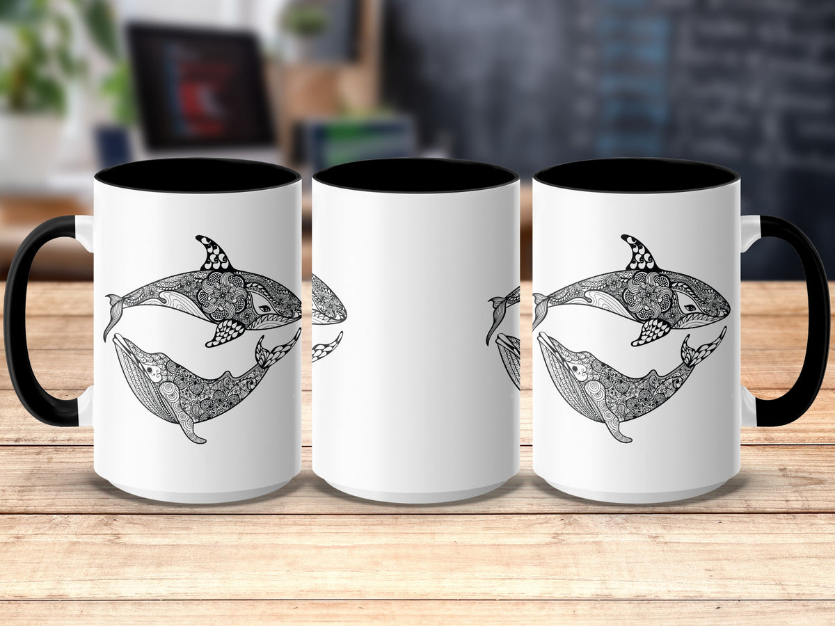 Three white mugs with black handles and rims, featuring black mandala-style whale and orca designs.