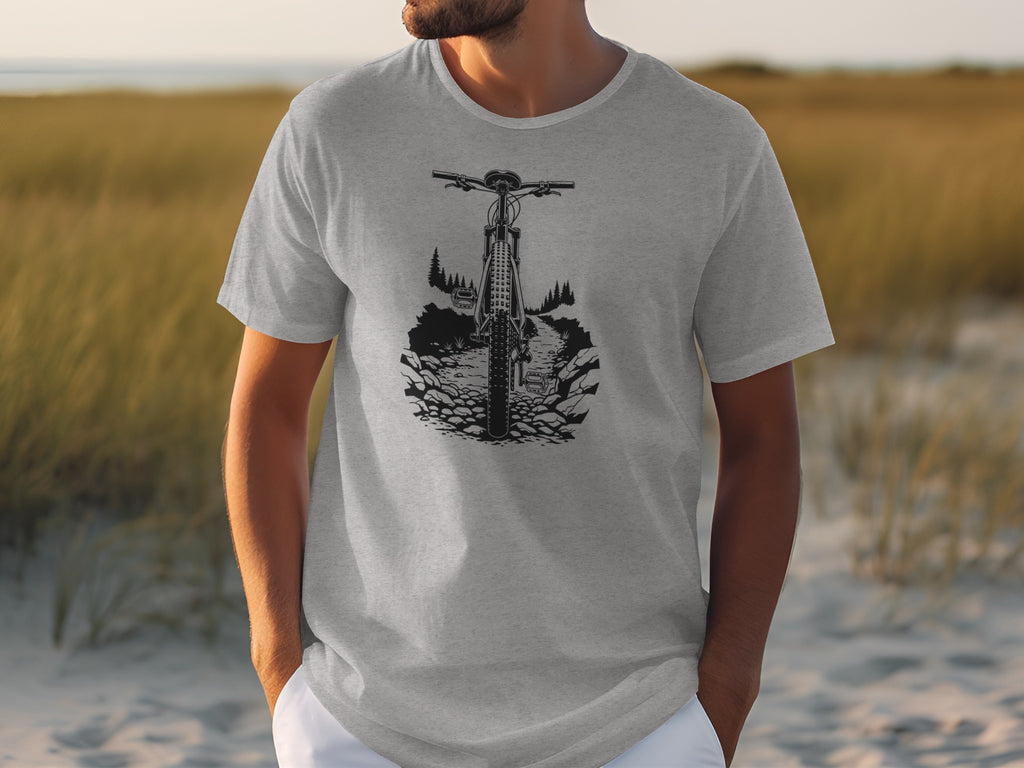 Grey t-shirt with a black graphic of a mountain bike on a rocky trail.