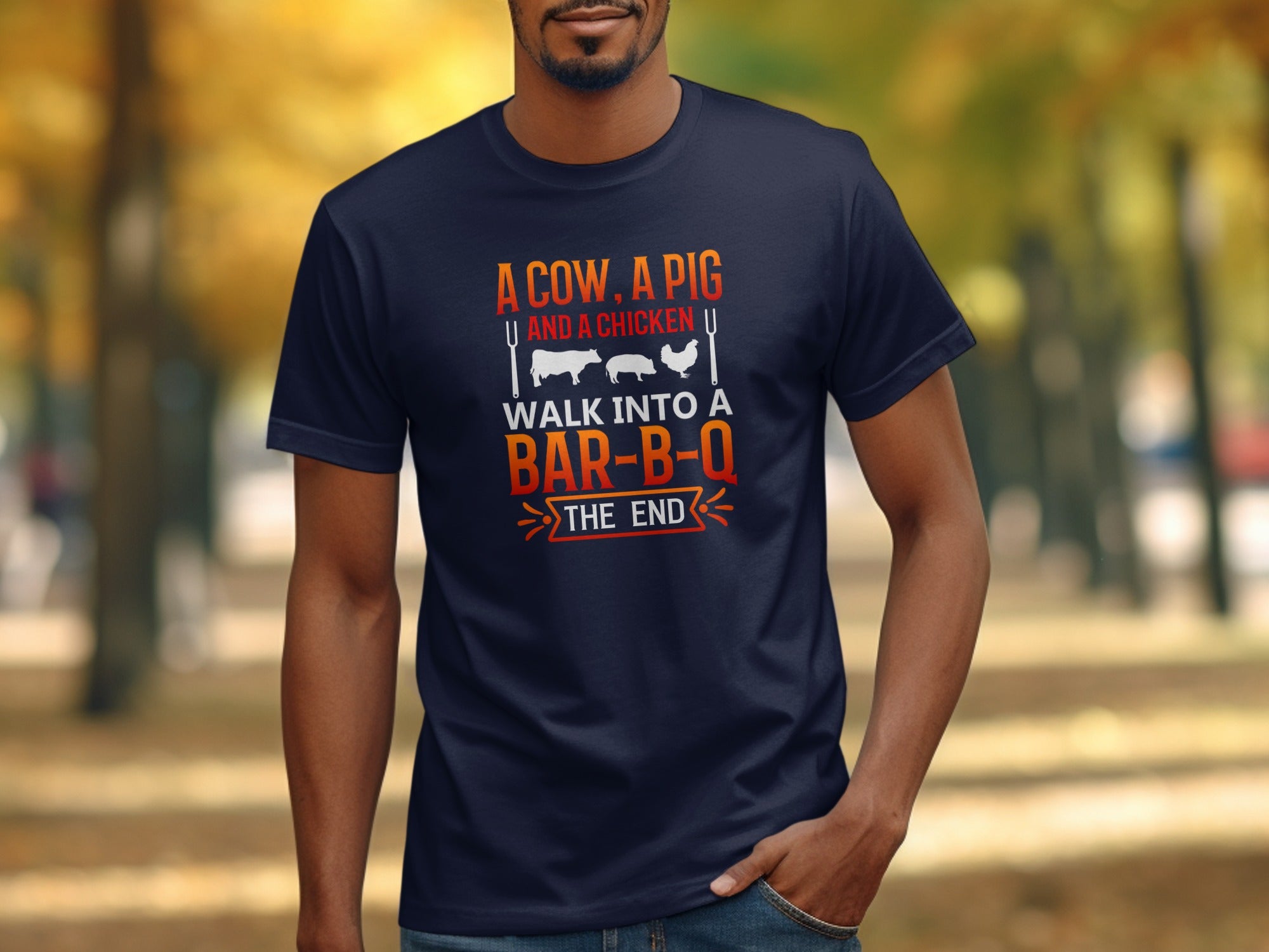 Navy t-shirt with graphic "A cow, a pig, and a chicken walk into a bar-b-q the end".