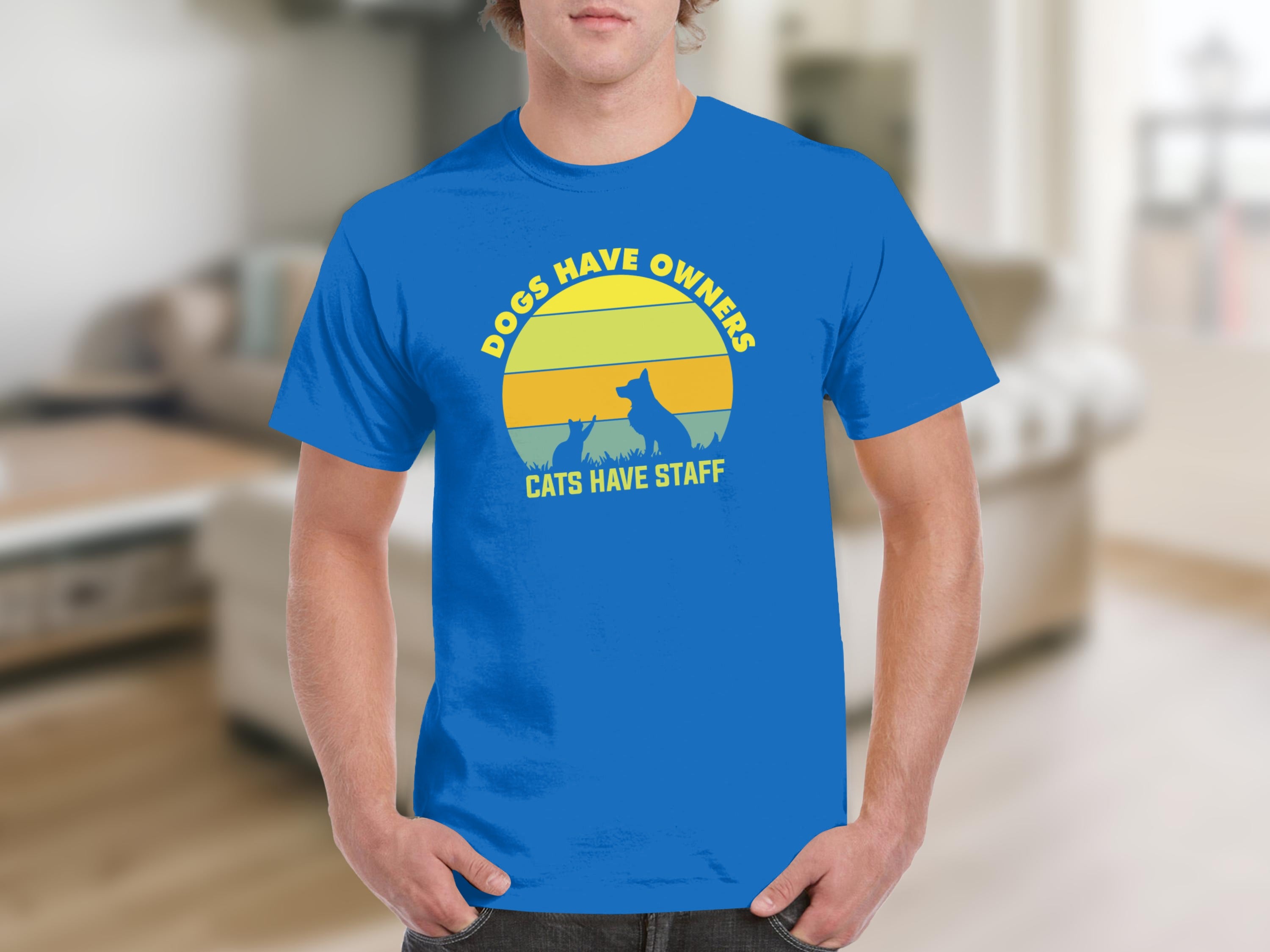 Blue t-shirt with "Dogs Have Owners, Cats Have Staff" text and animal silhouettes.