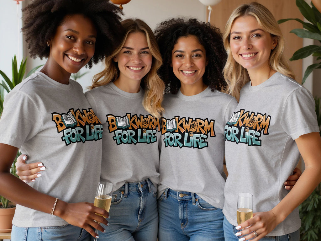 Four women in gray t-shirts with "BOOKWORM FOR LIFE" graphic smile at the camera.