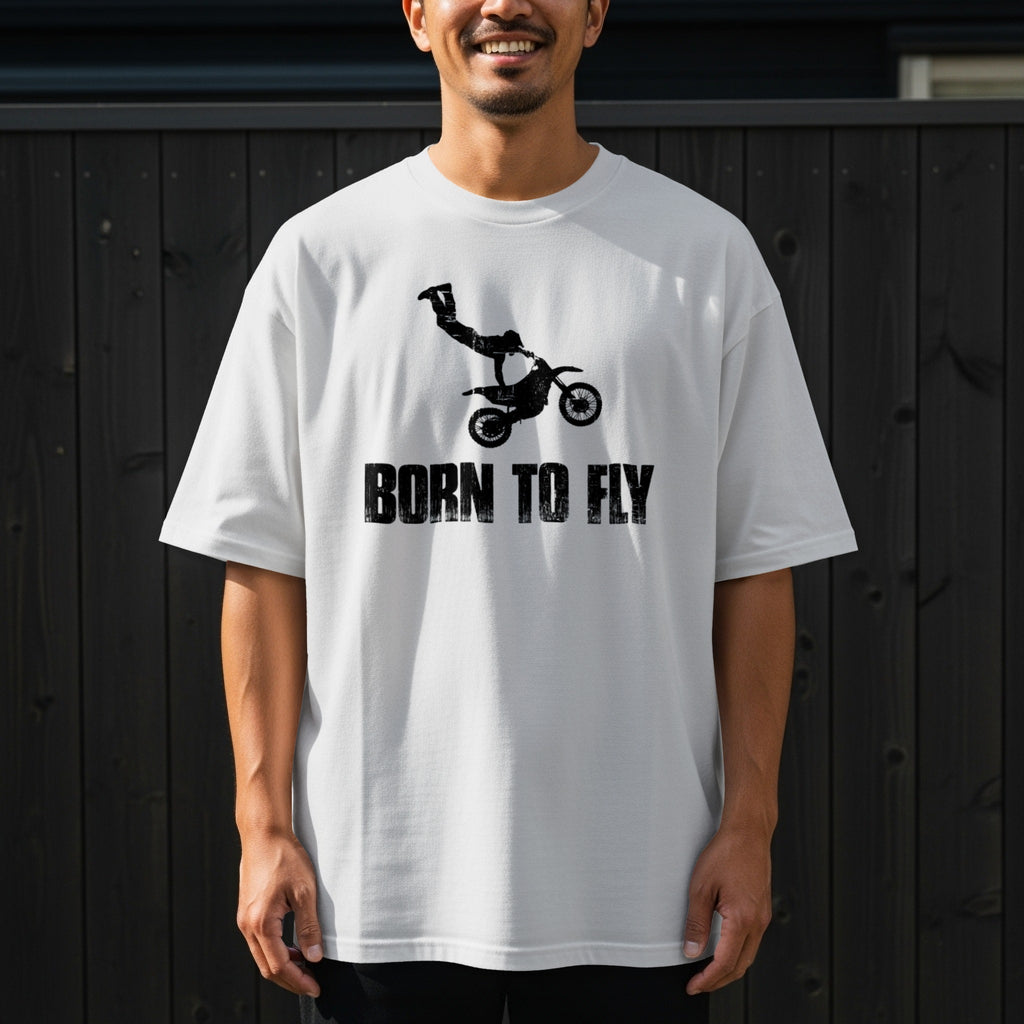 White t-shirt with a black graphic of a dirt bike rider mid-air and "BORN TO FLY" text.