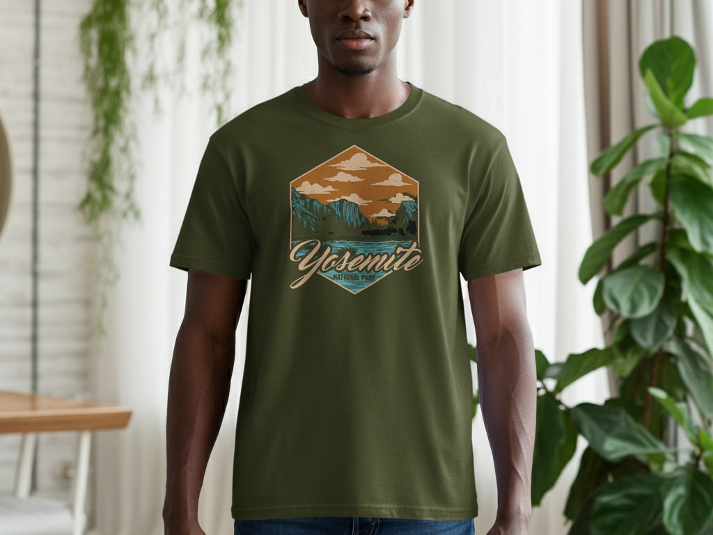 Green t-shirt featuring a hexagonal graphic of Yosemite National Park with mountains and a lake.