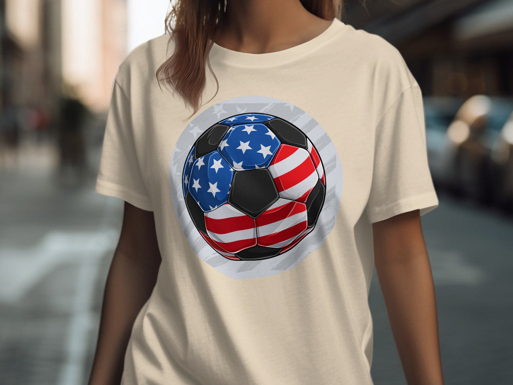 T-shirt with a graphic of a soccer ball designed with the American flag pattern.