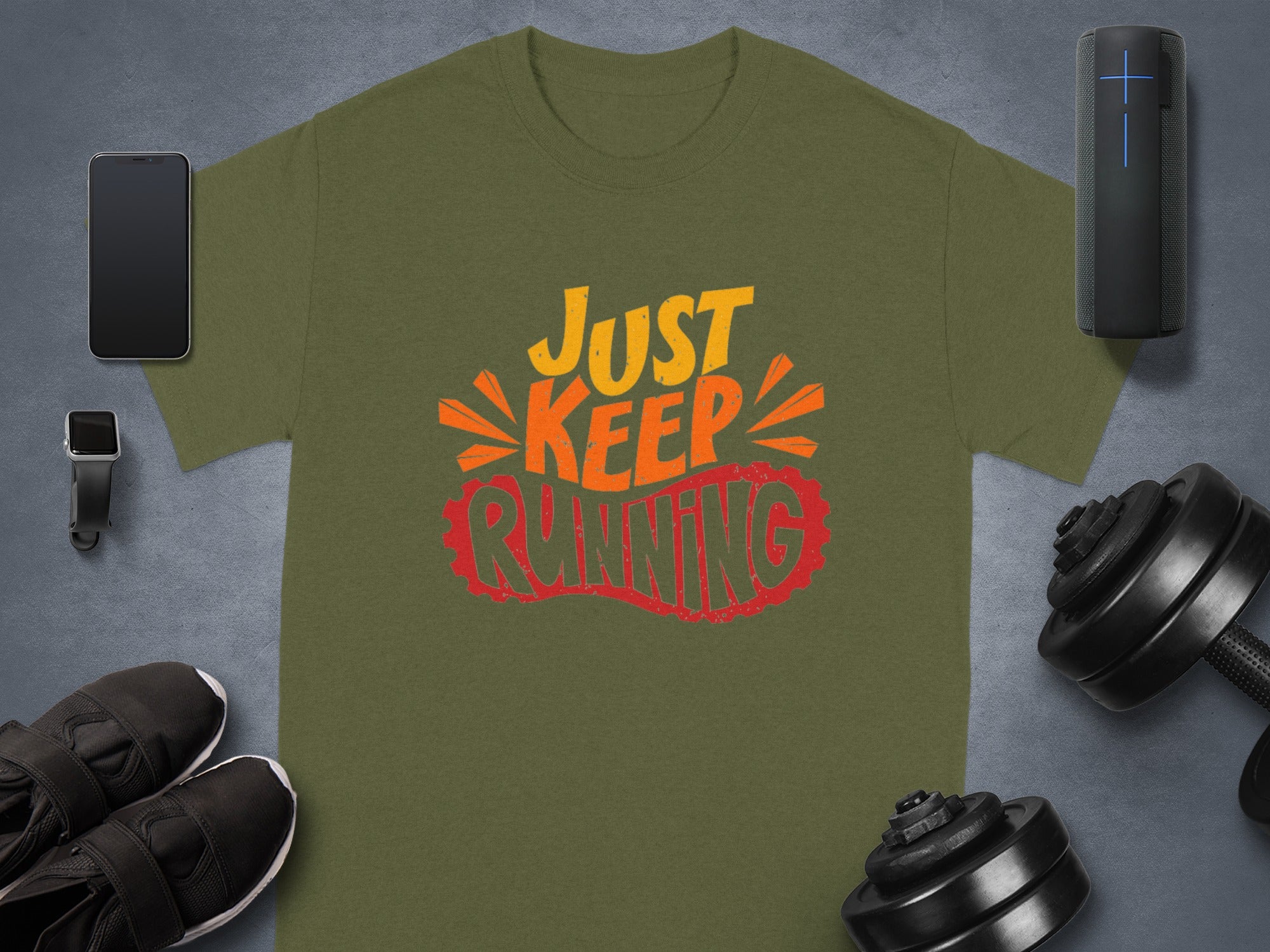 Olive green t-shirt with "JUST KEEP RUNNING" in colorful text with athletic gear.