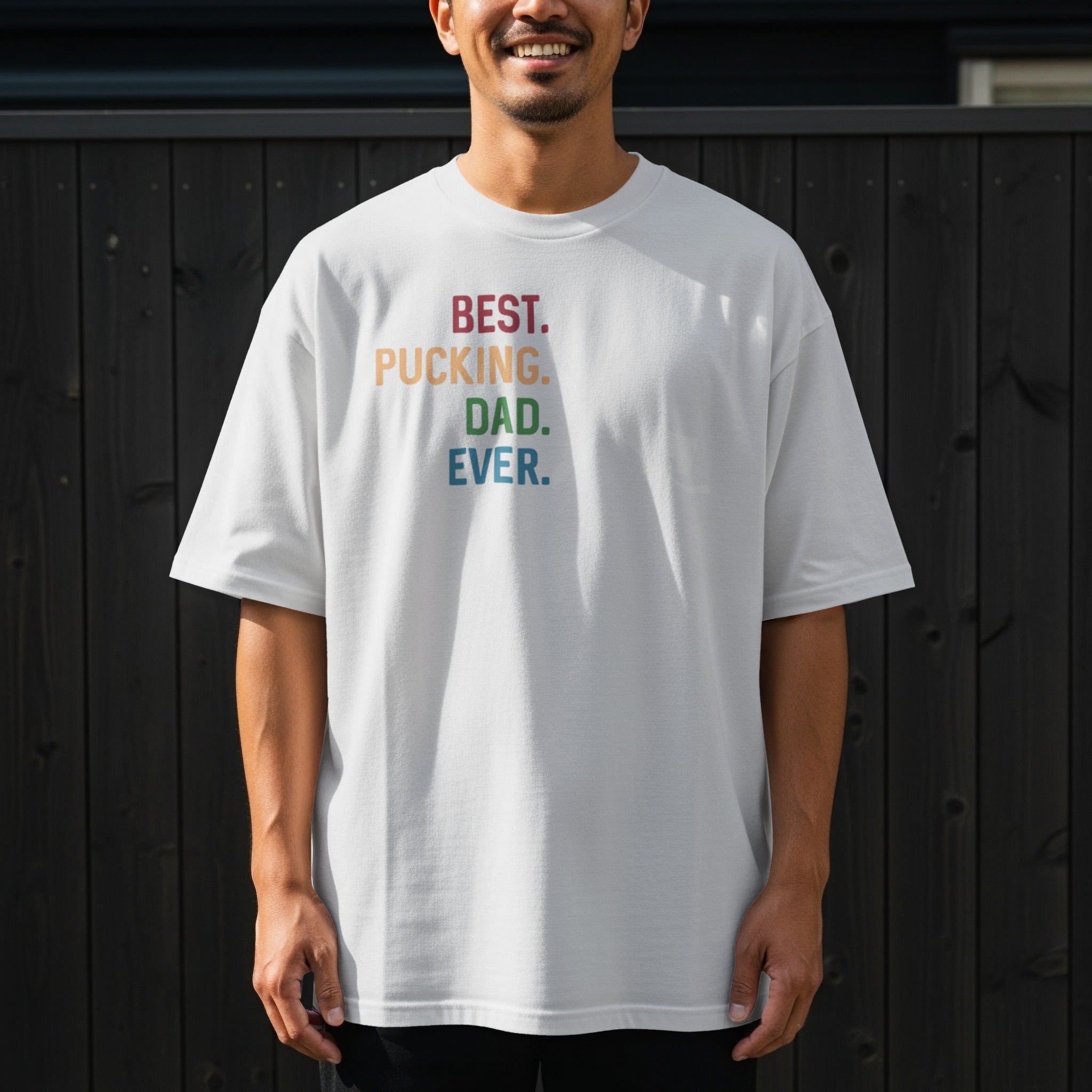White t-shirt with "Best. Pucking. Dad. Ever." text in colorful block letters.