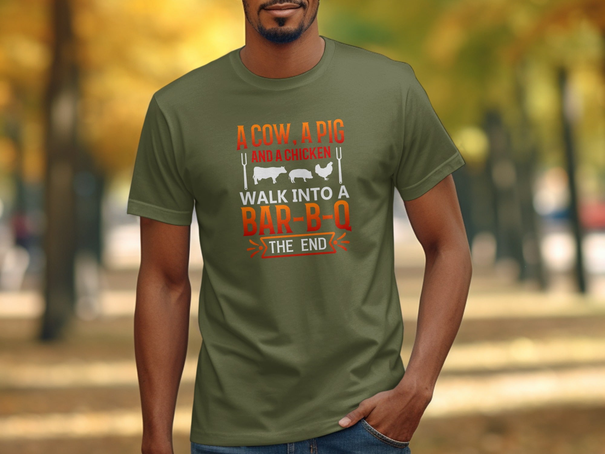Olive green t-shirt with "A cow, a pig and a chicken walk into a bar-b-q the end" text.