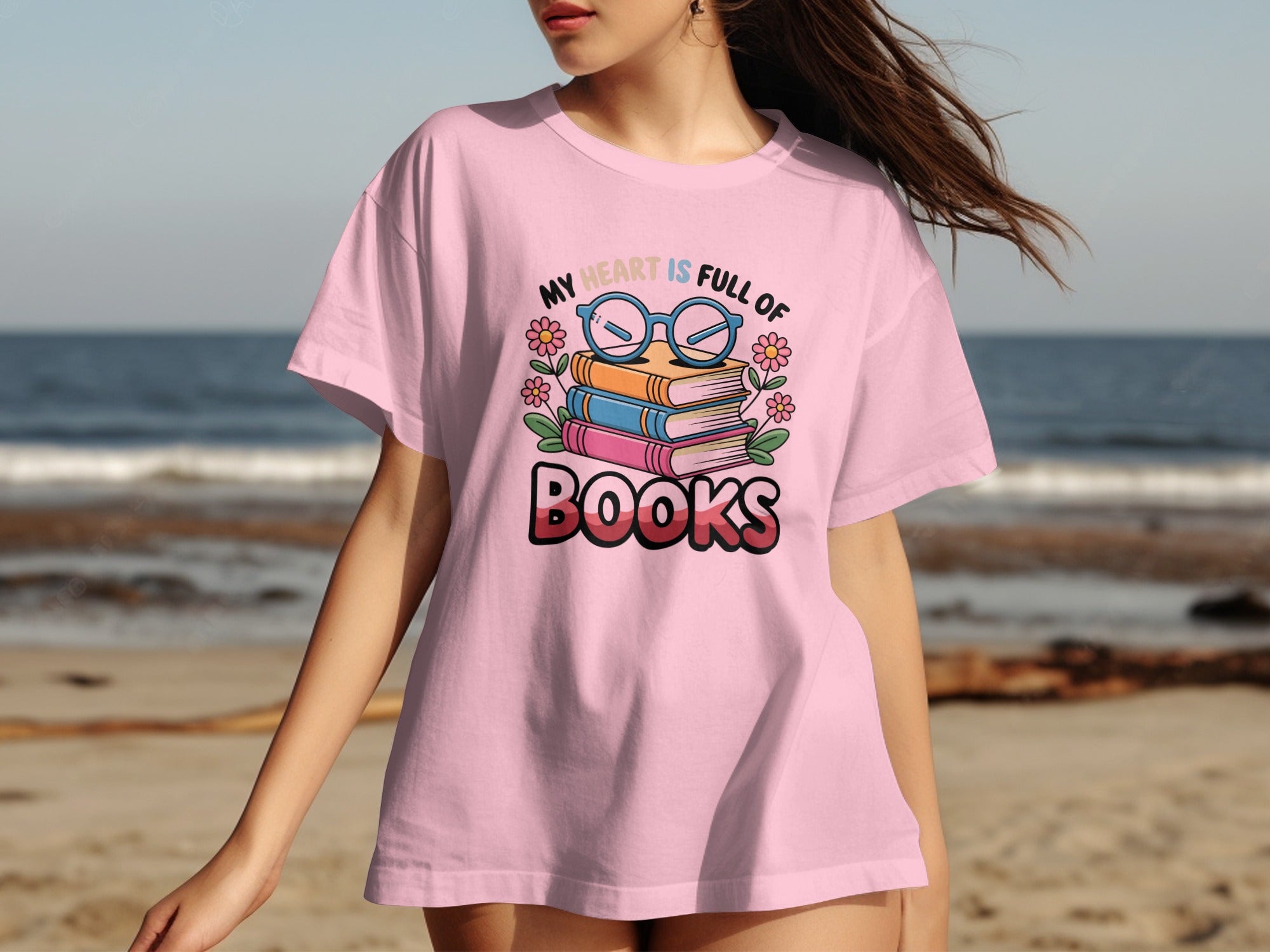 Pink t-shirt with quote "My heart is full of Books" and stacked books illustration.