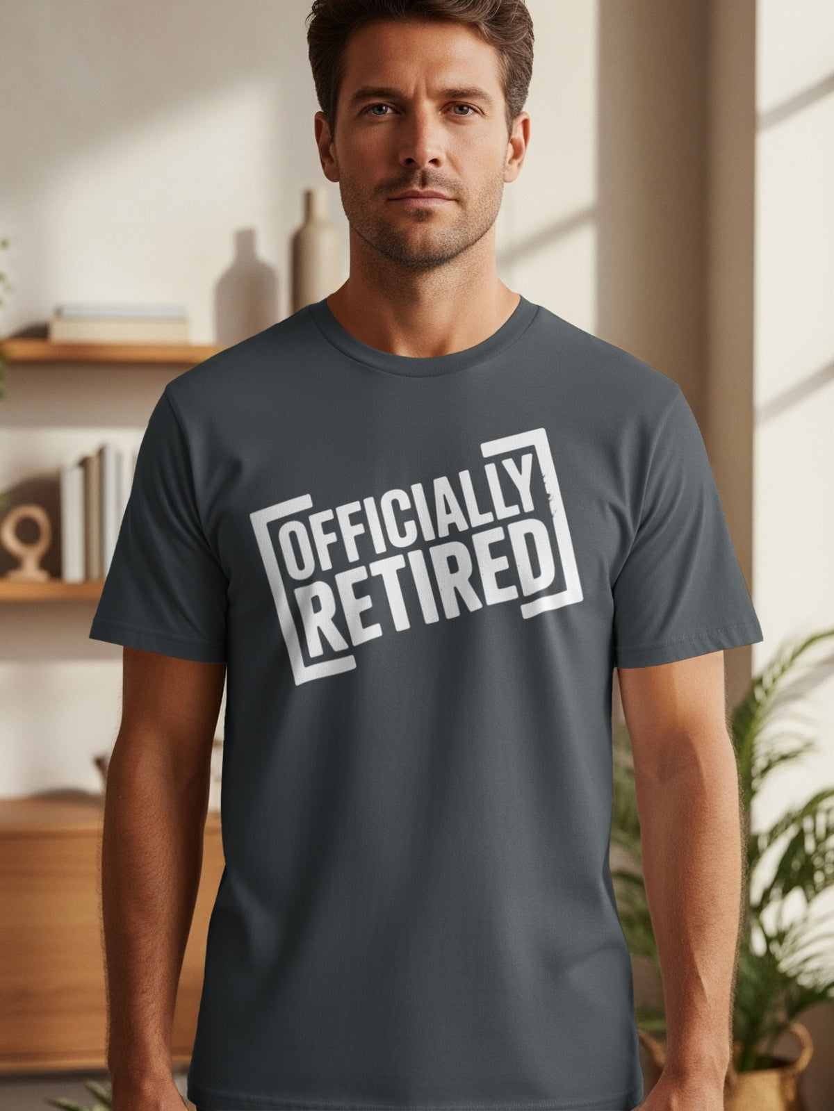 Dark gray t-shirt with white "OFFICIALLY RETIRED" text in a box design.