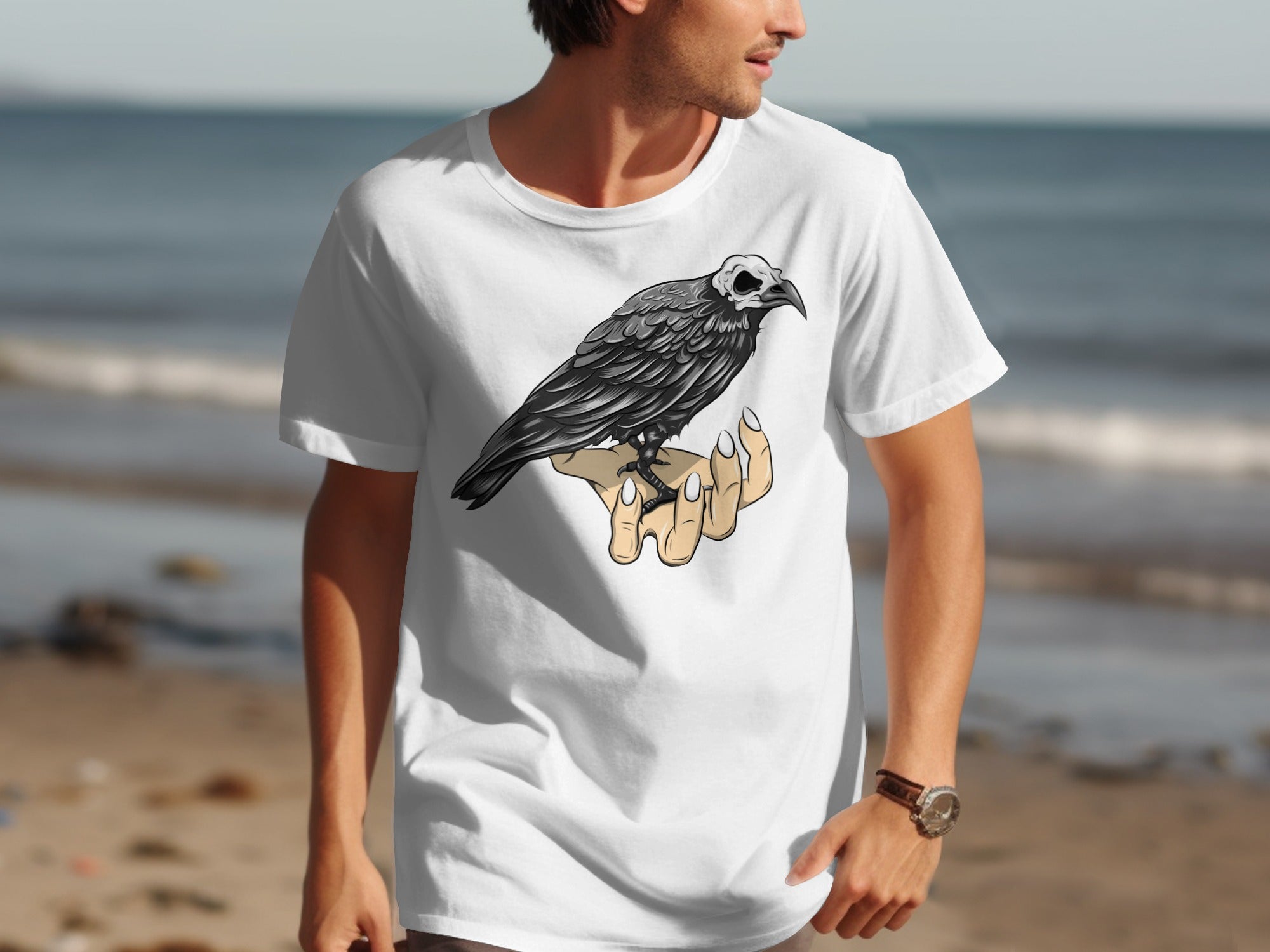 T-shirt with a black crow with a skull face perched on a hand.