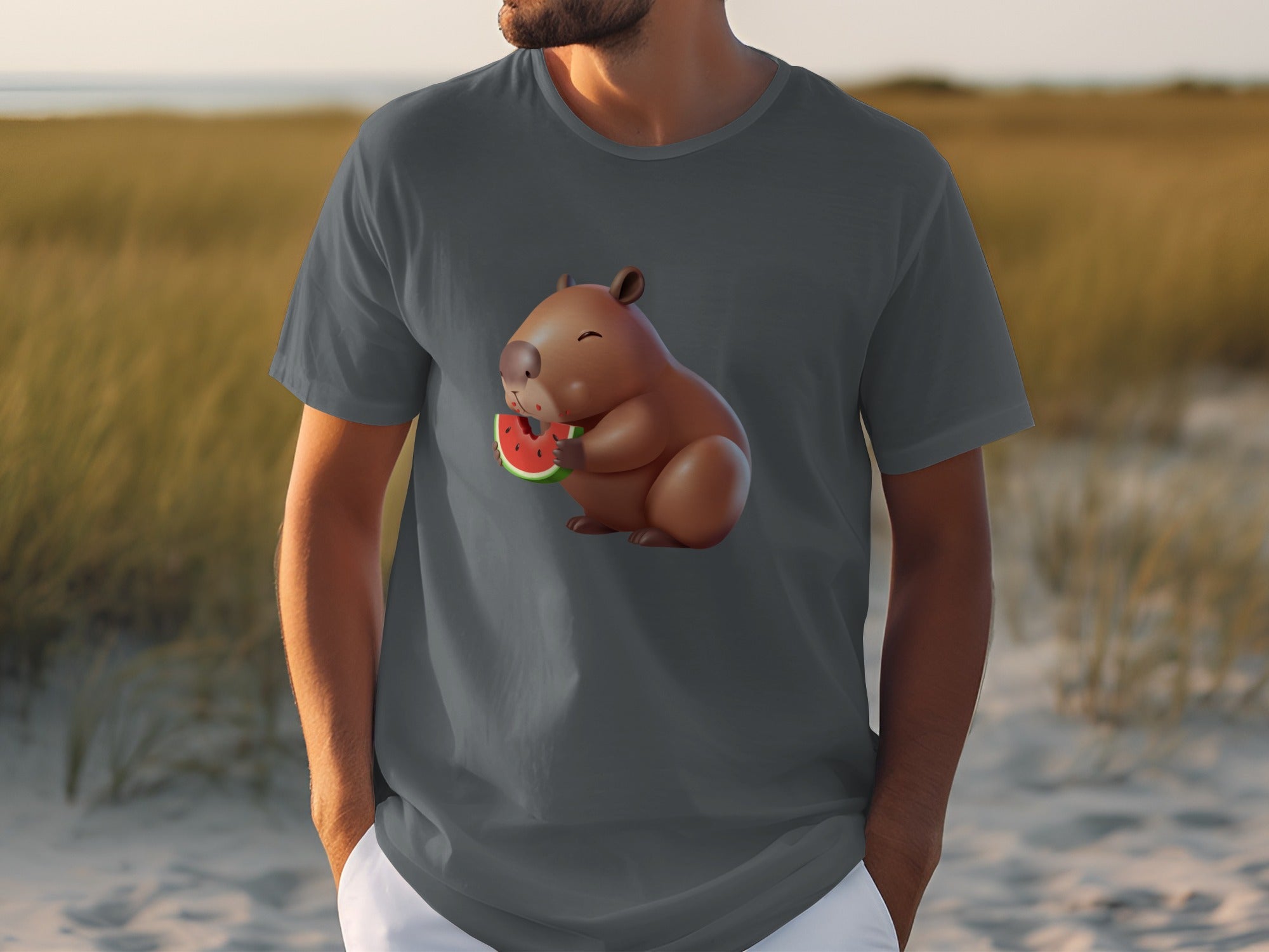 Cartoon capybara eating a slice of watermelon on a dark grey t-shirt.
