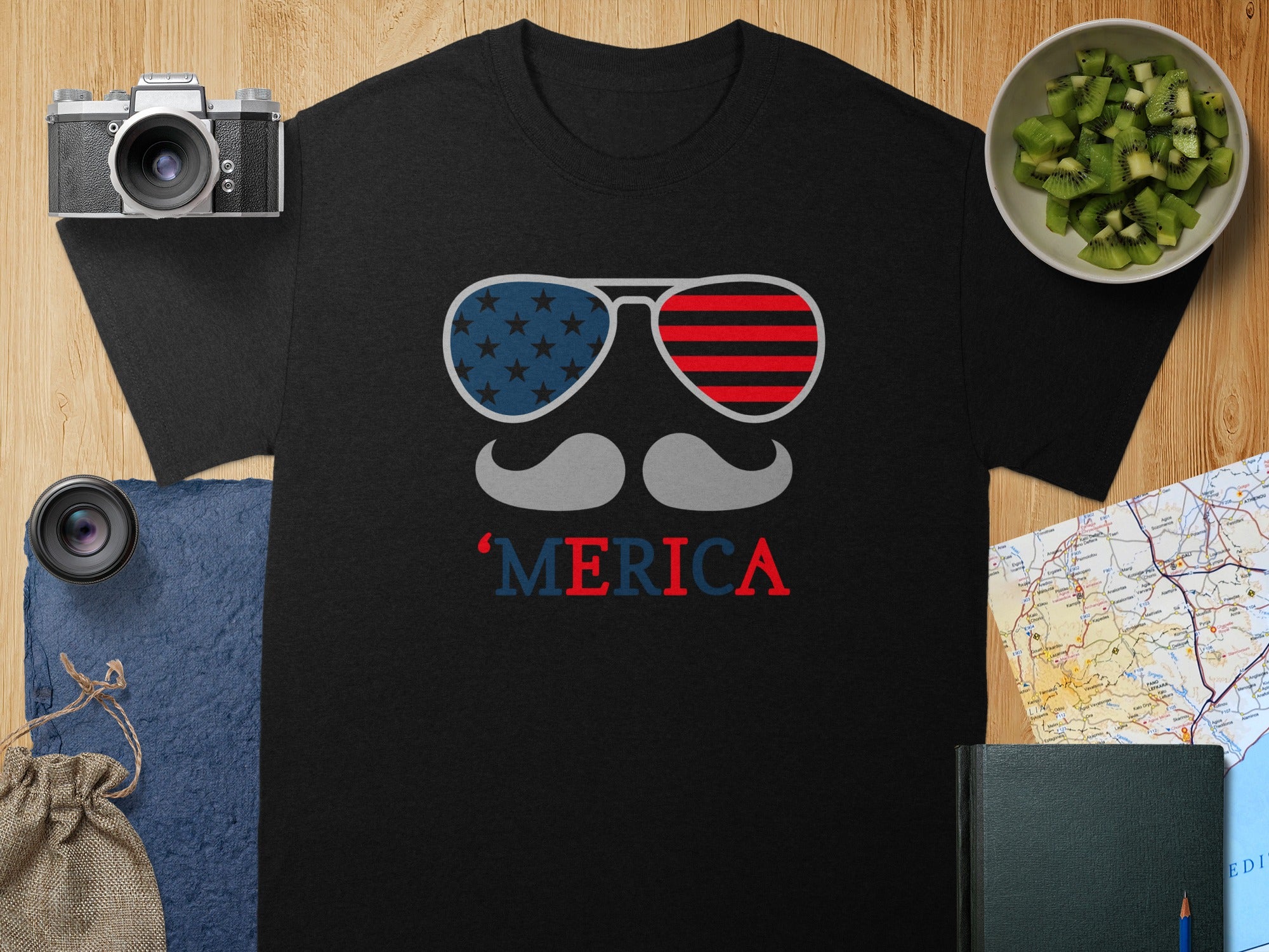 Black t-shirt with patriotic sunglasses and mustache graphic that says 'MERICA.
