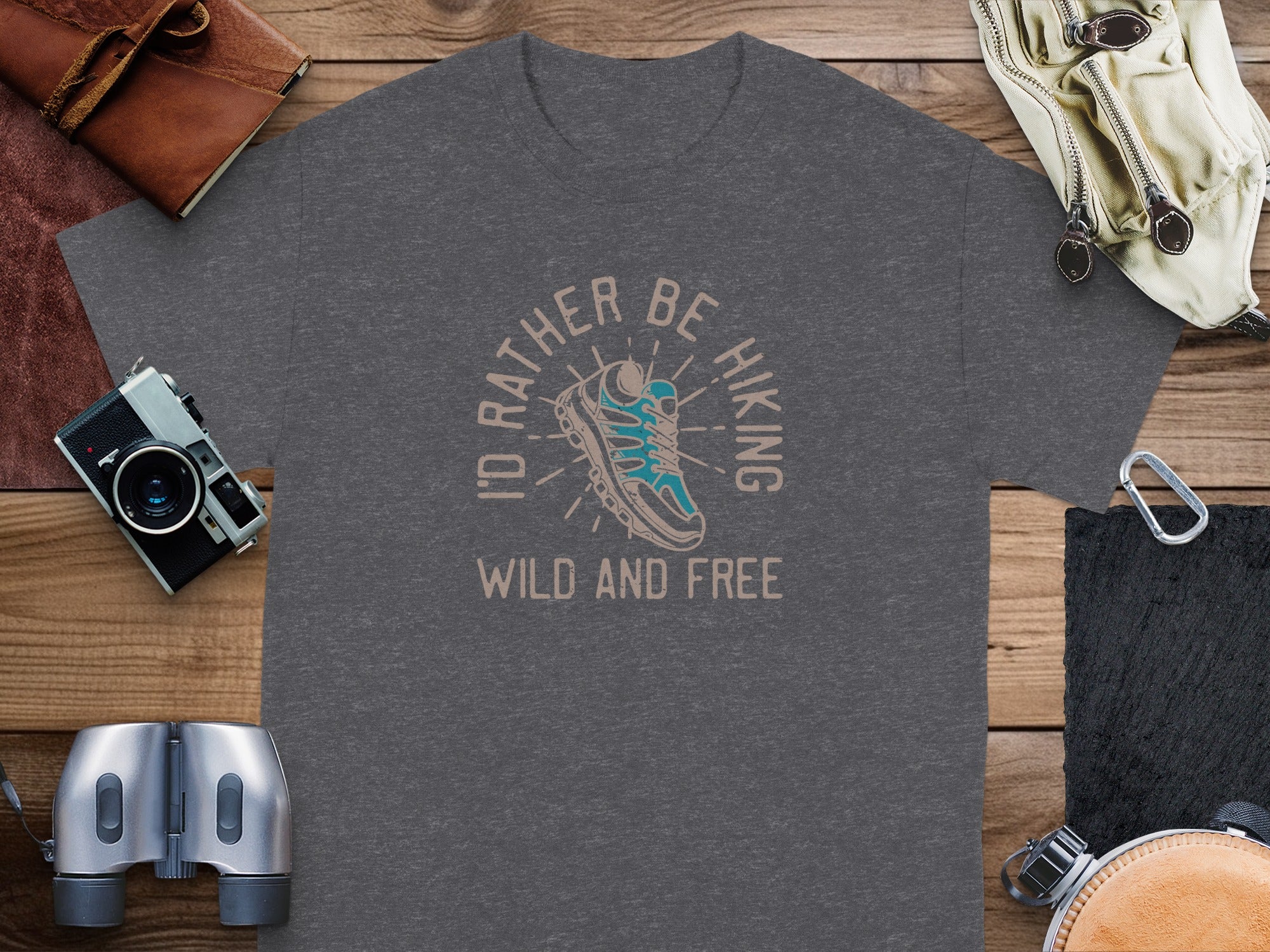 Dark grey t-shirt with a hiking shoe graphic and "I'd rather be hiking wild and free" text.