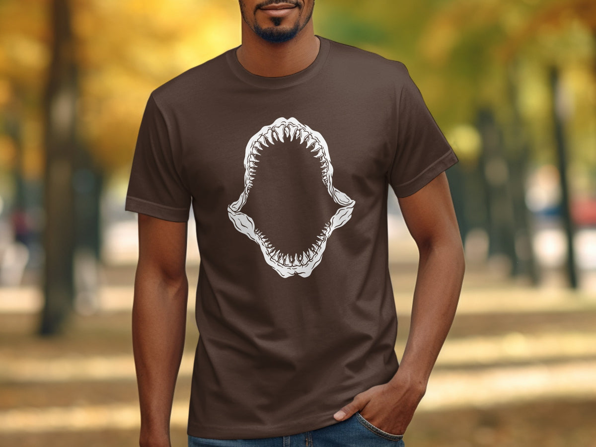 Brown t-shirt with a white shark jaw graphic and sharp teeth design.