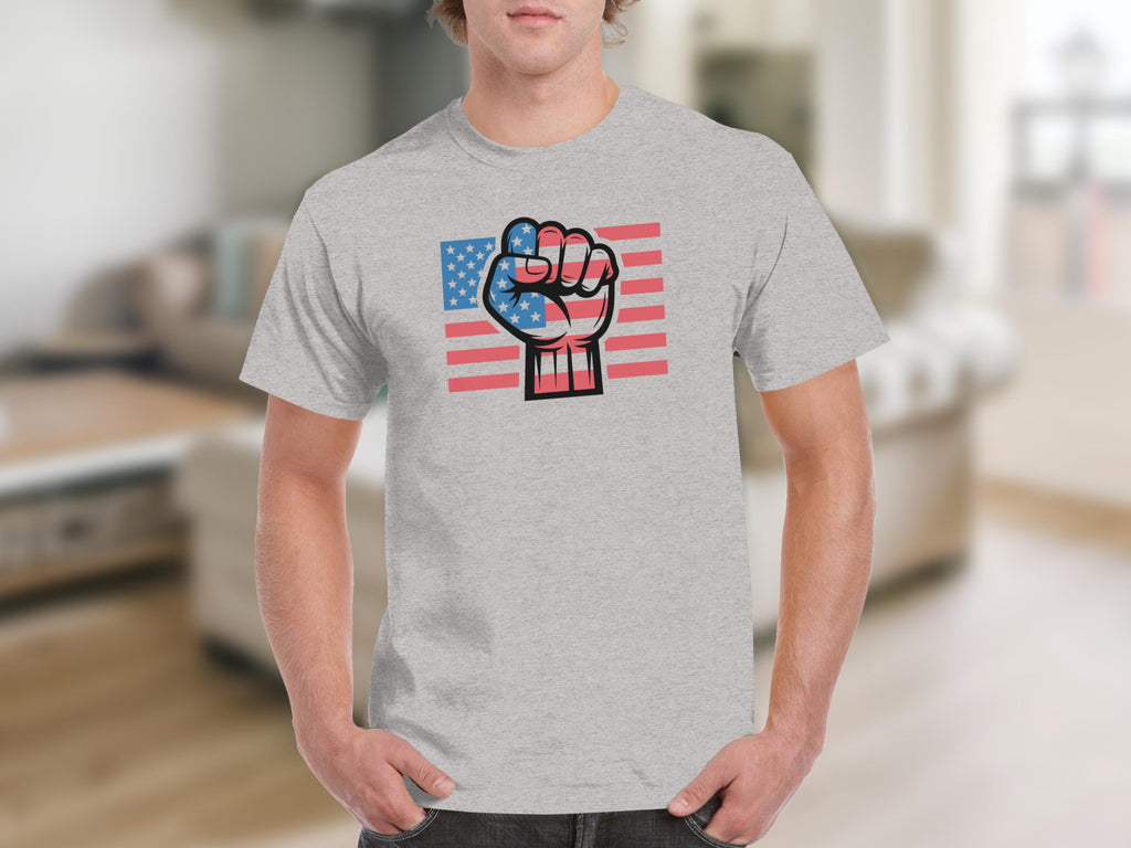 Fist overlaid on an American flag design on a grey t-shirt.