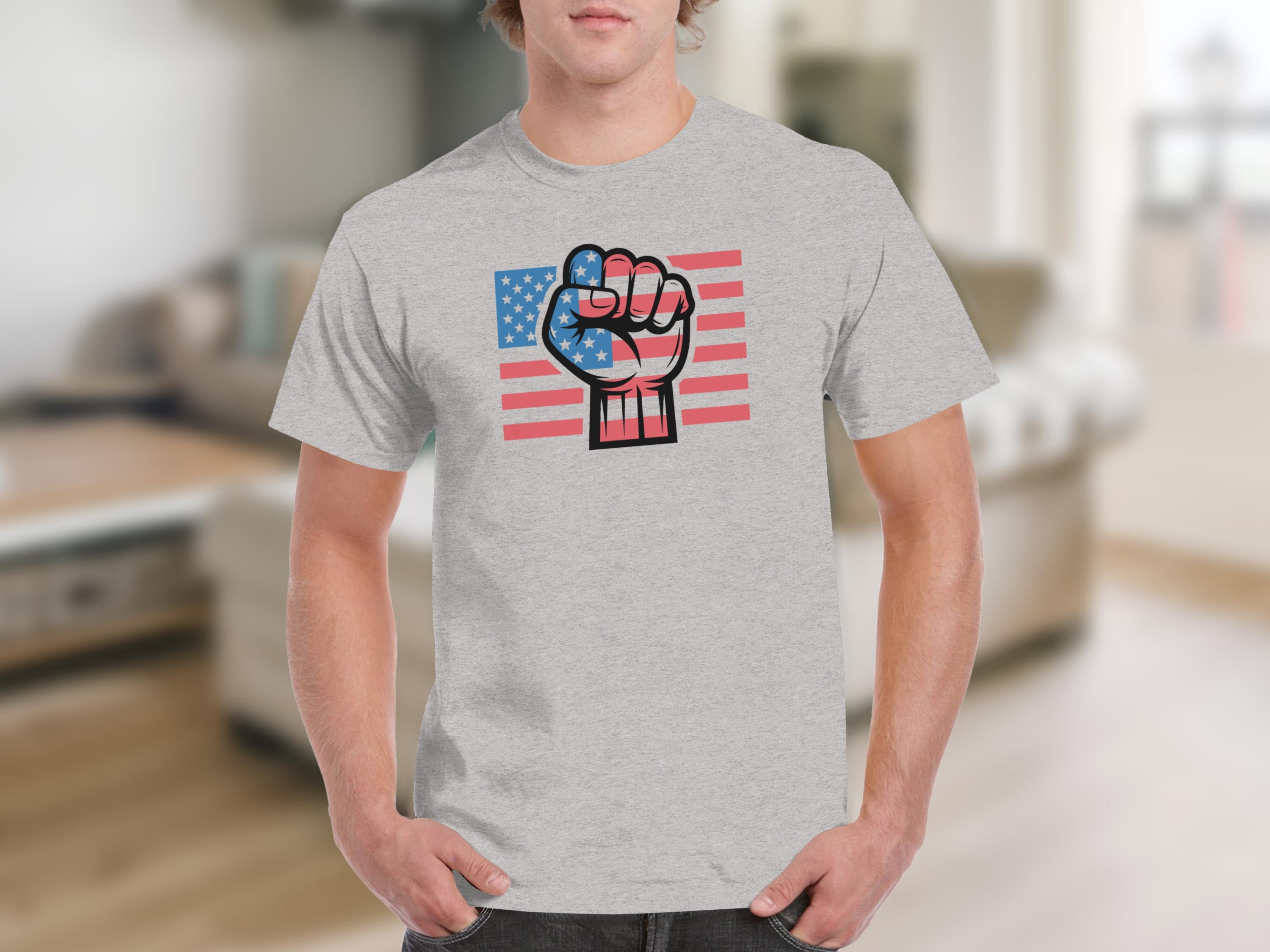 Fist overlaid on an American flag design on a grey t-shirt.