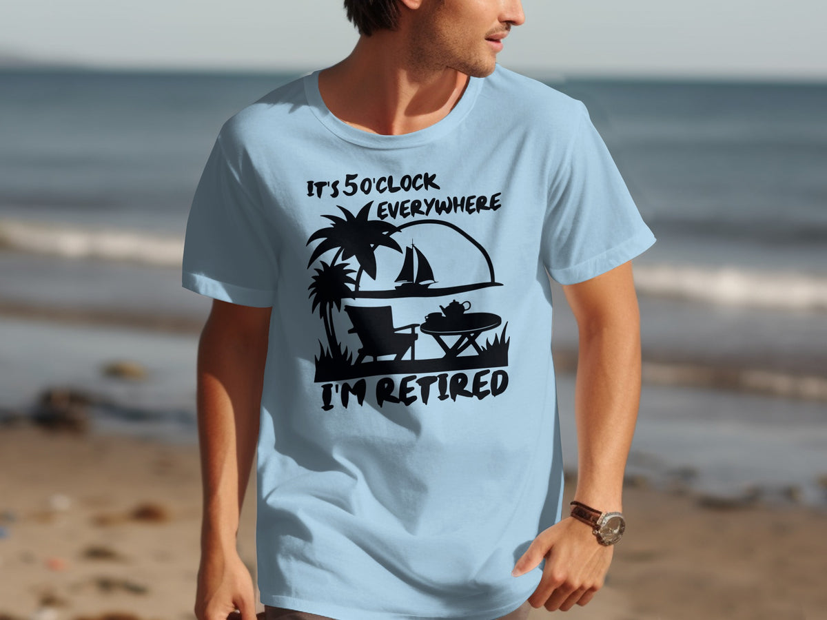 Light blue t-shirt with graphic: "IT'S 5 O'CLOCK EVERYWHERE I'M RETIRED".