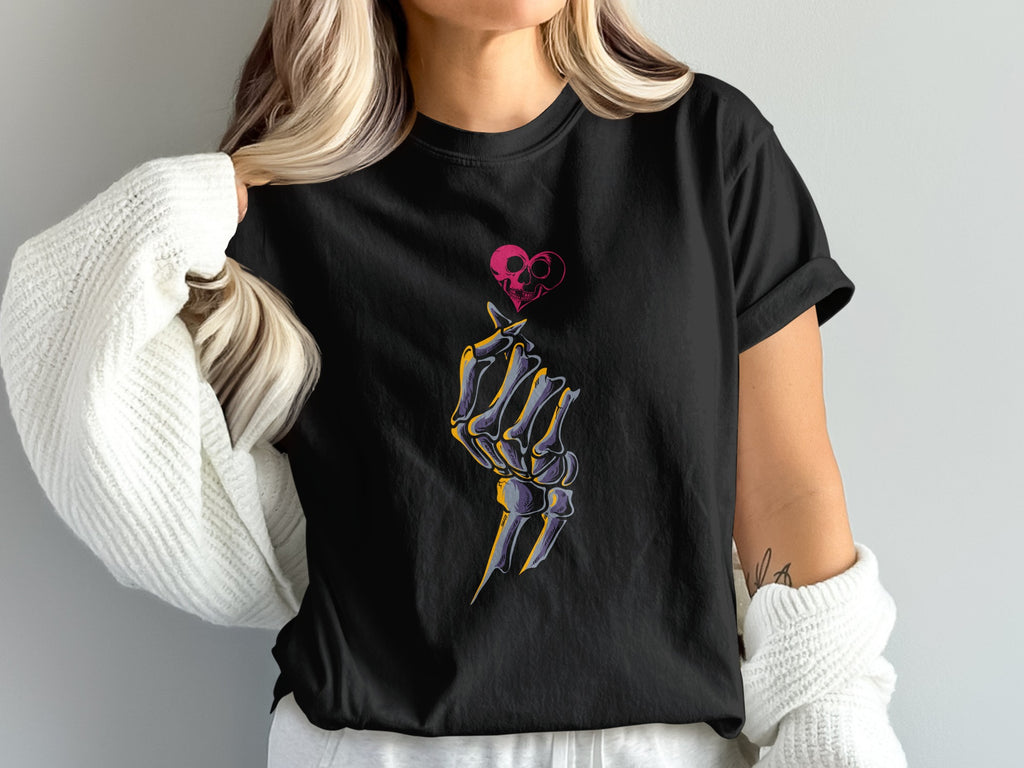 Black t-shirt with a skeleton hand making a heart shape and a skull heart.