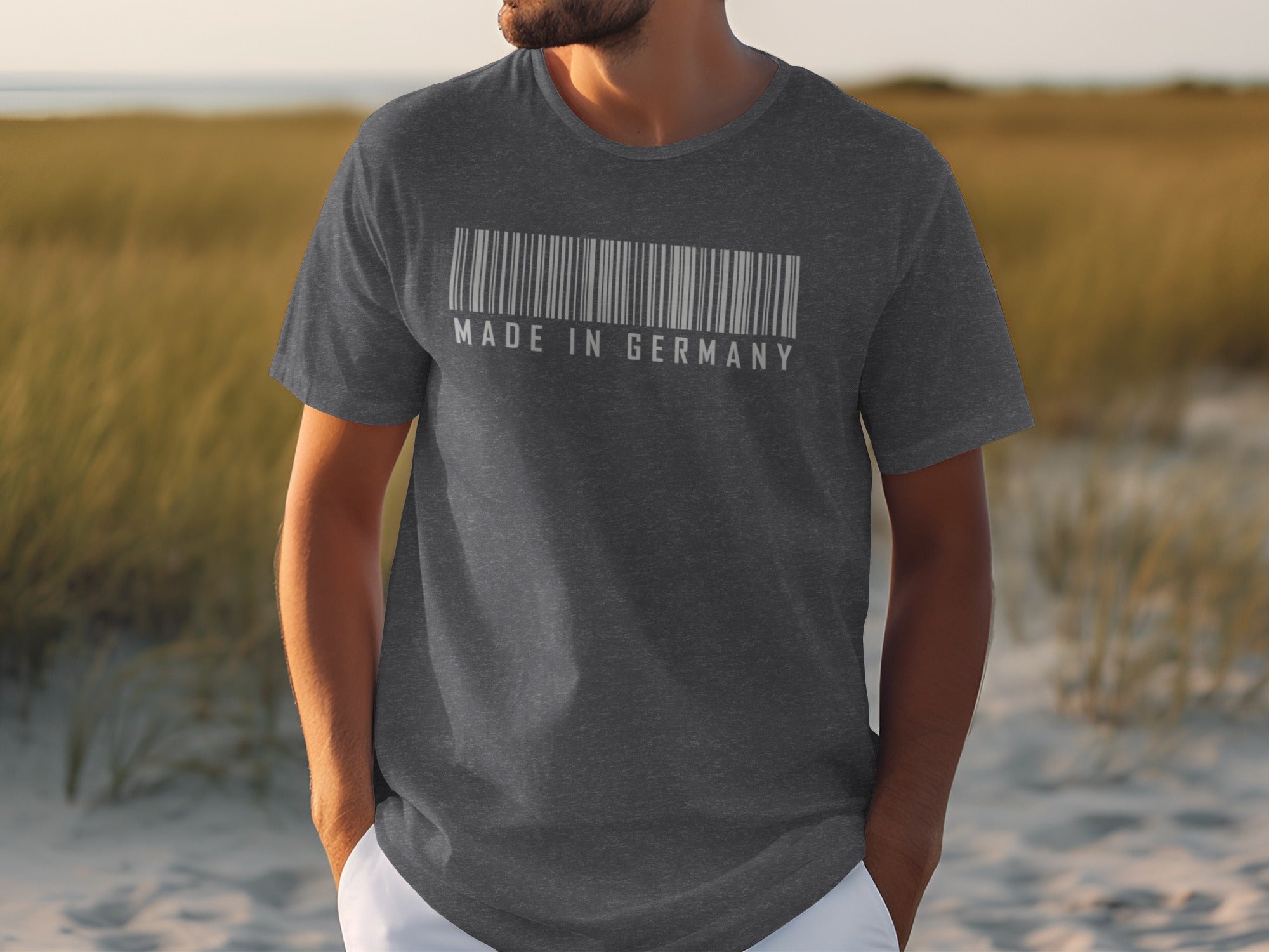 Dark grey t-shirt with a white barcode and "MADE IN GERMANY" text.