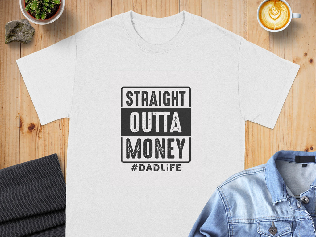 White t-shirt with "STRAIGHT OUTTA MONEY #DADLIFE" graphic.