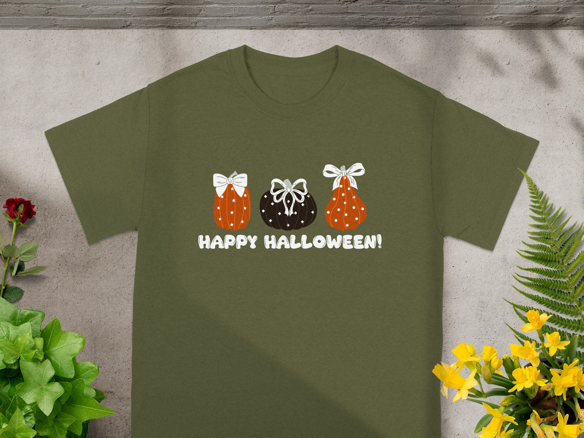 Green t-shirt with three decorative pumpkins and text "HAPPY HALLOWEEN!"