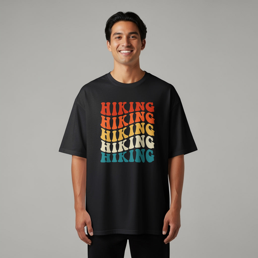 Black t-shirt with repeated "Hiking" text in retro wavy font colors.