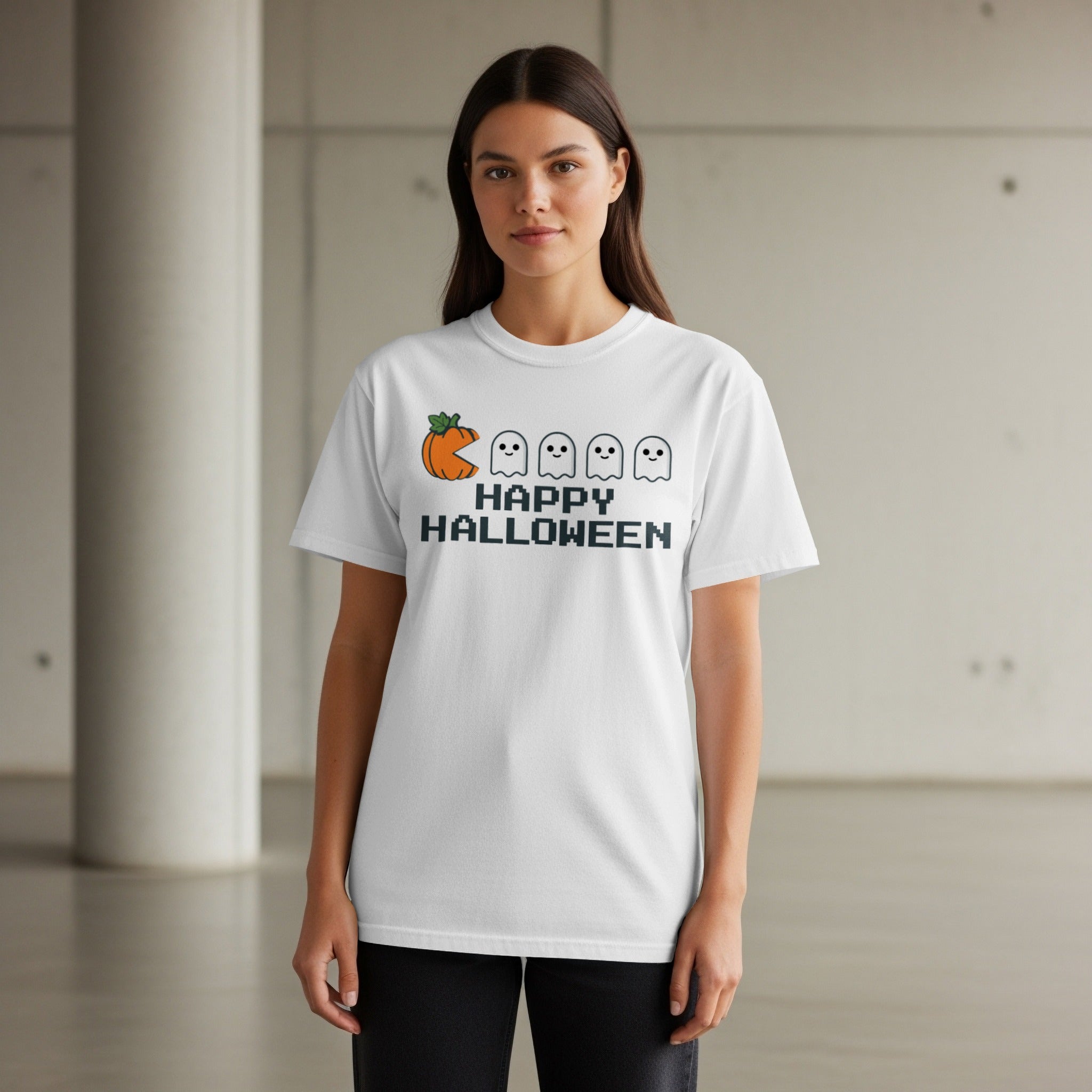 White t-shirt with pixelated Halloween graphic: pumpkin, ghosts, and text.