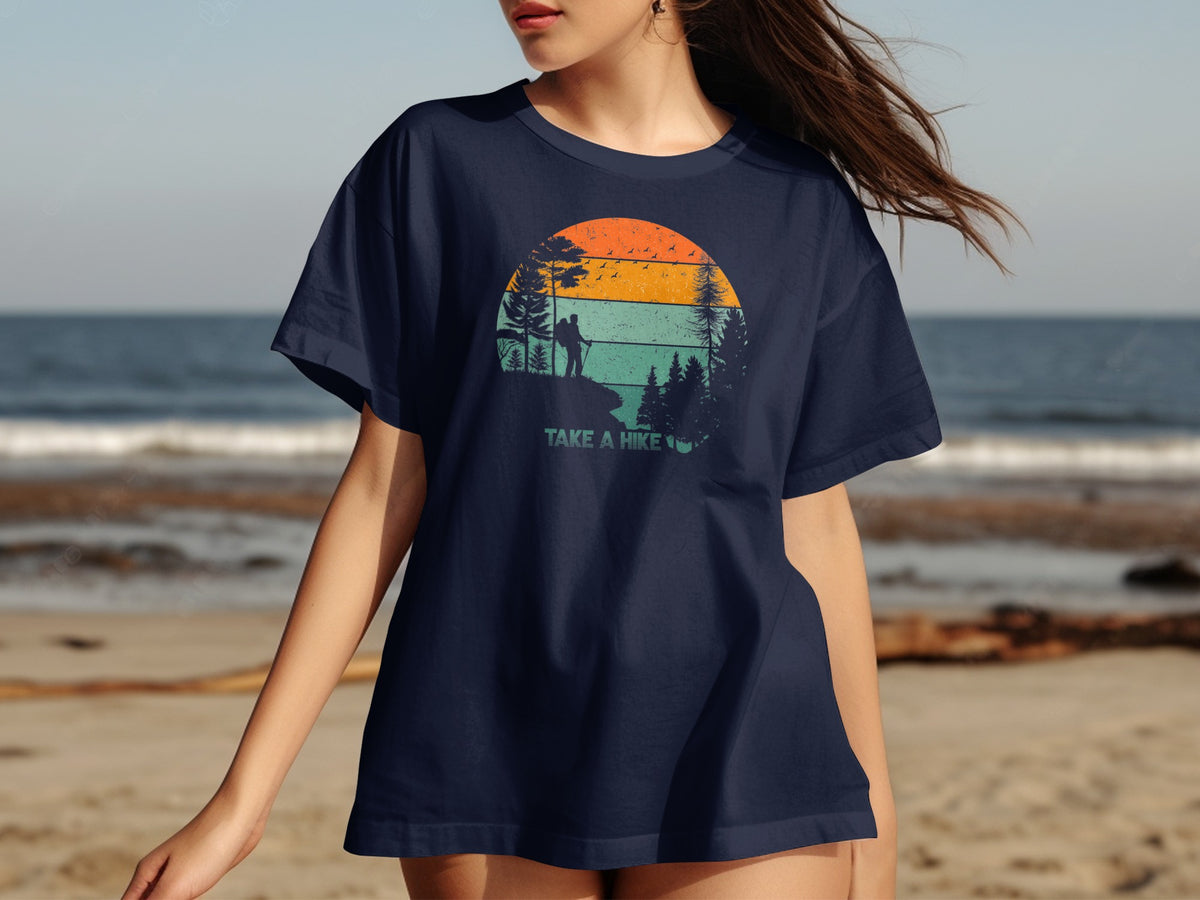 Navy t-shirt with a vintage sunset graphic and the text "TAKE A HIKE".