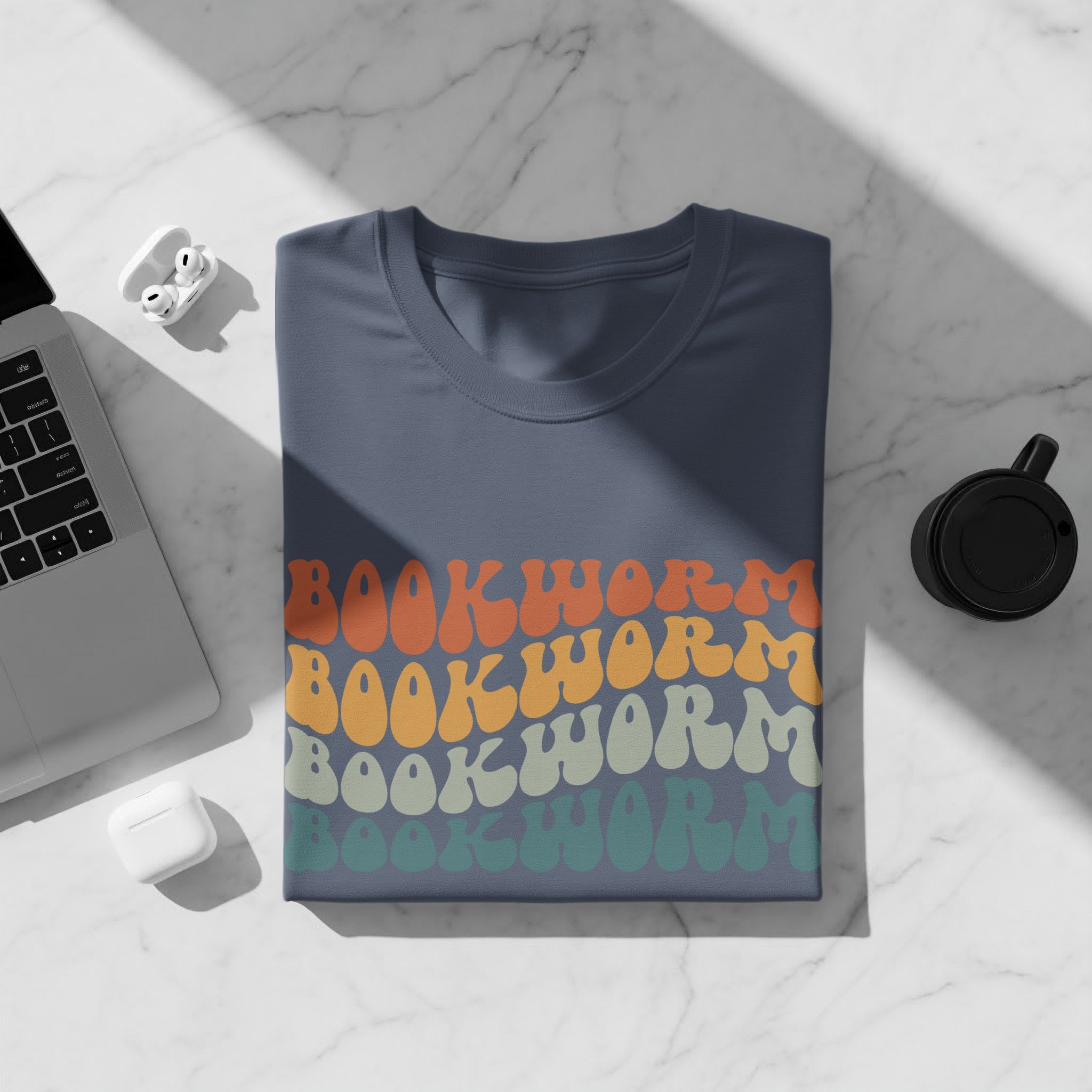 Blue t-shirt with "Bookworm" text in retro-style lettering.