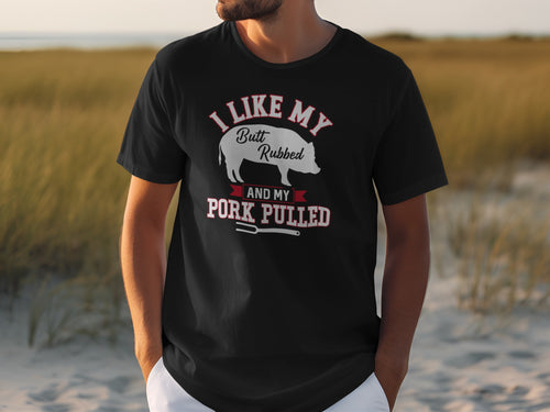 Black t-shirt with text "I Like My Butt Rubbed and my Pork Pulled" and a pig graphic.