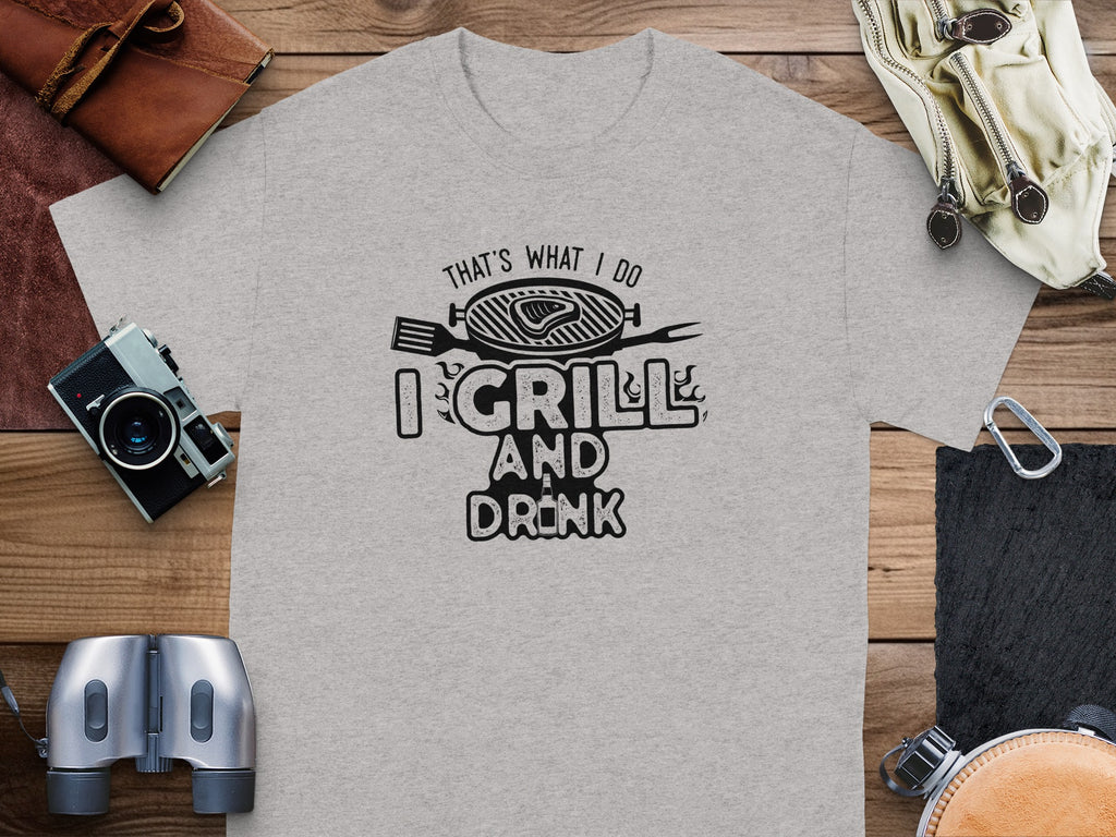 Grey t-shirt with black graphic text "That's What I Do I Grill and Drink."