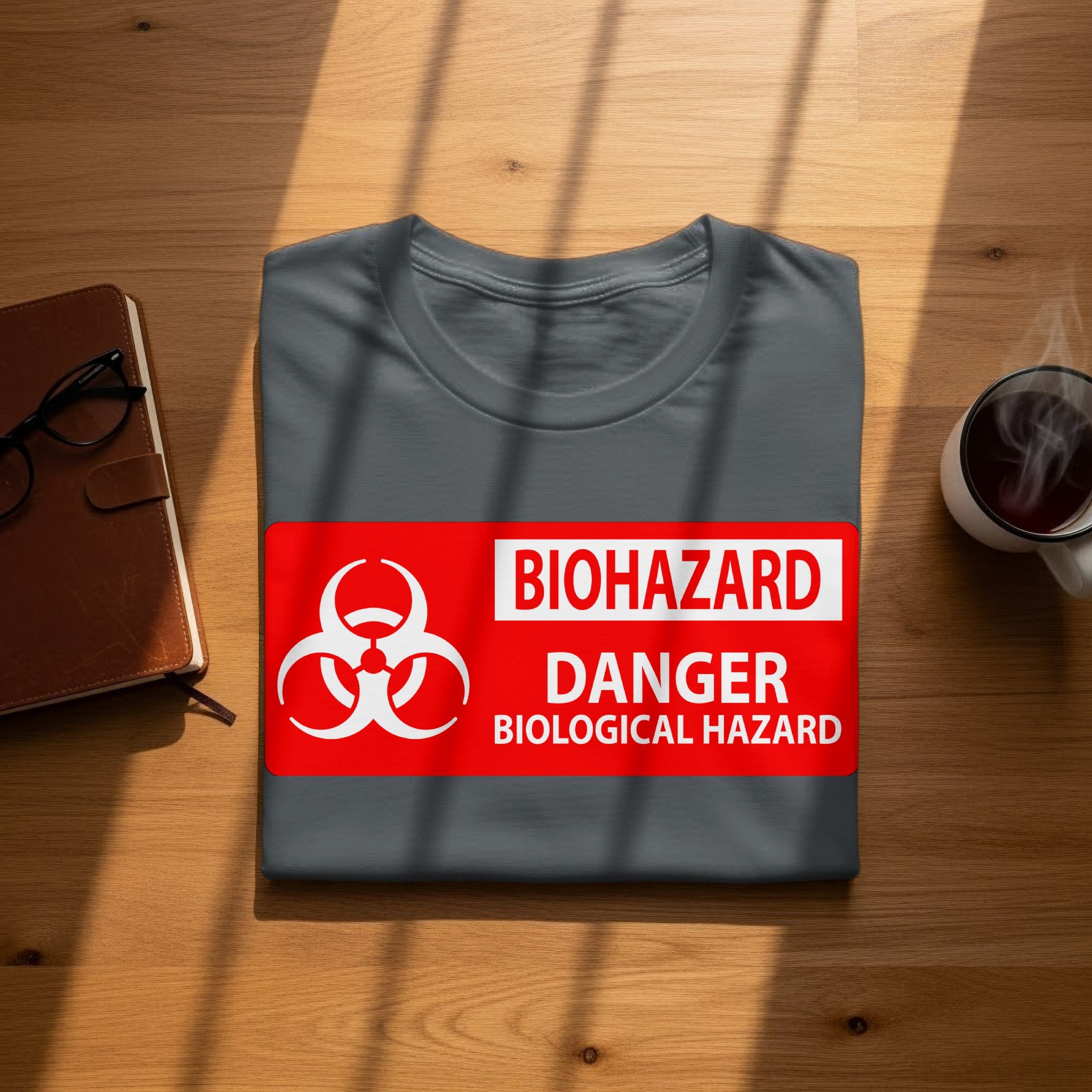Grey t-shirt with biohazard symbol, "BIOHAZARD", "DANGER", and "BIOLOGICAL HAZARD" text.